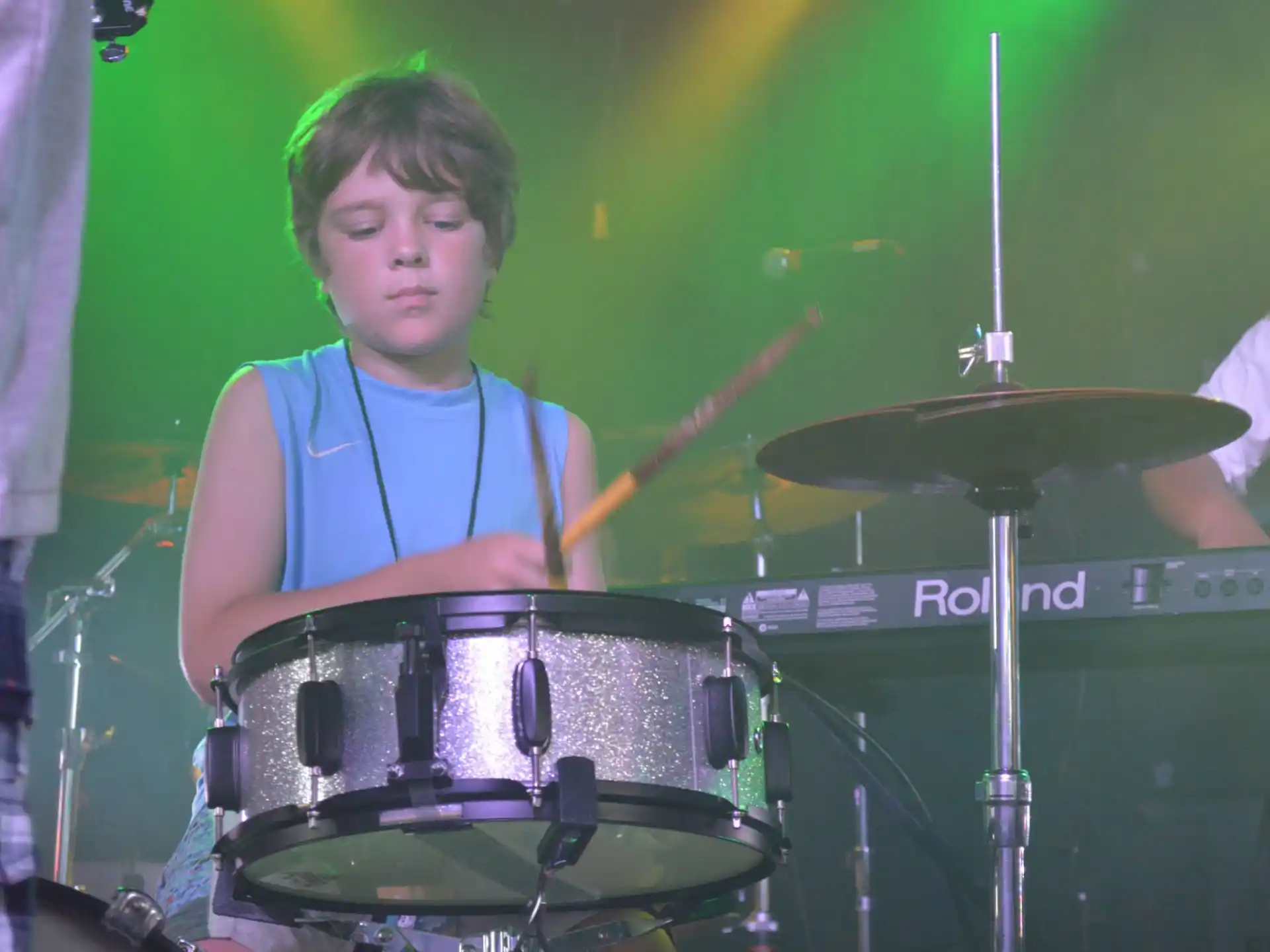 a boy playing drums