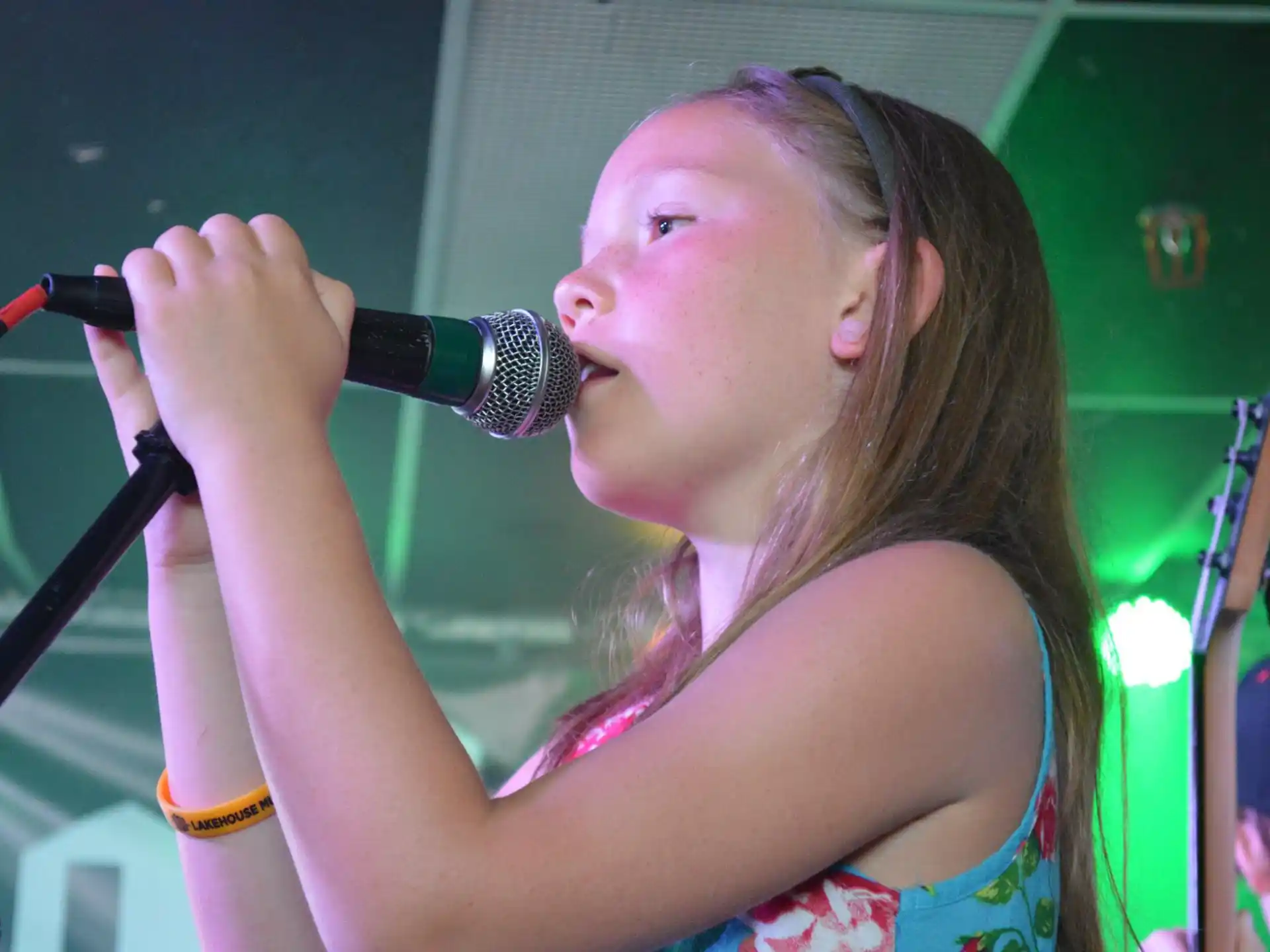 a person singing into a microphone