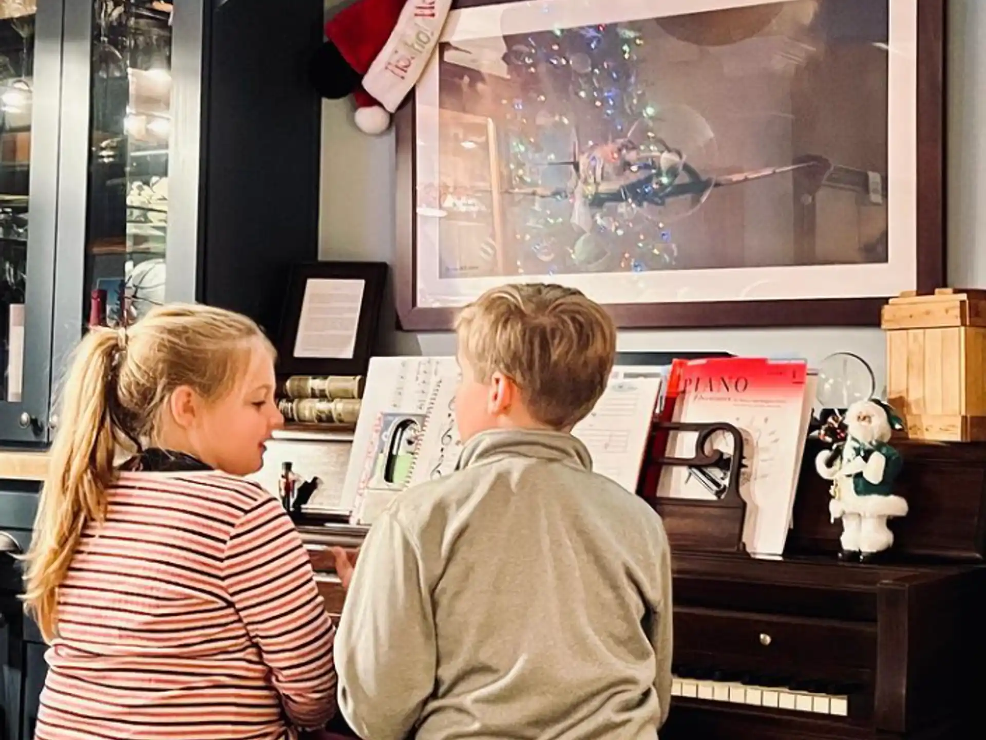 a man and a woman looking at a display of a fish tank