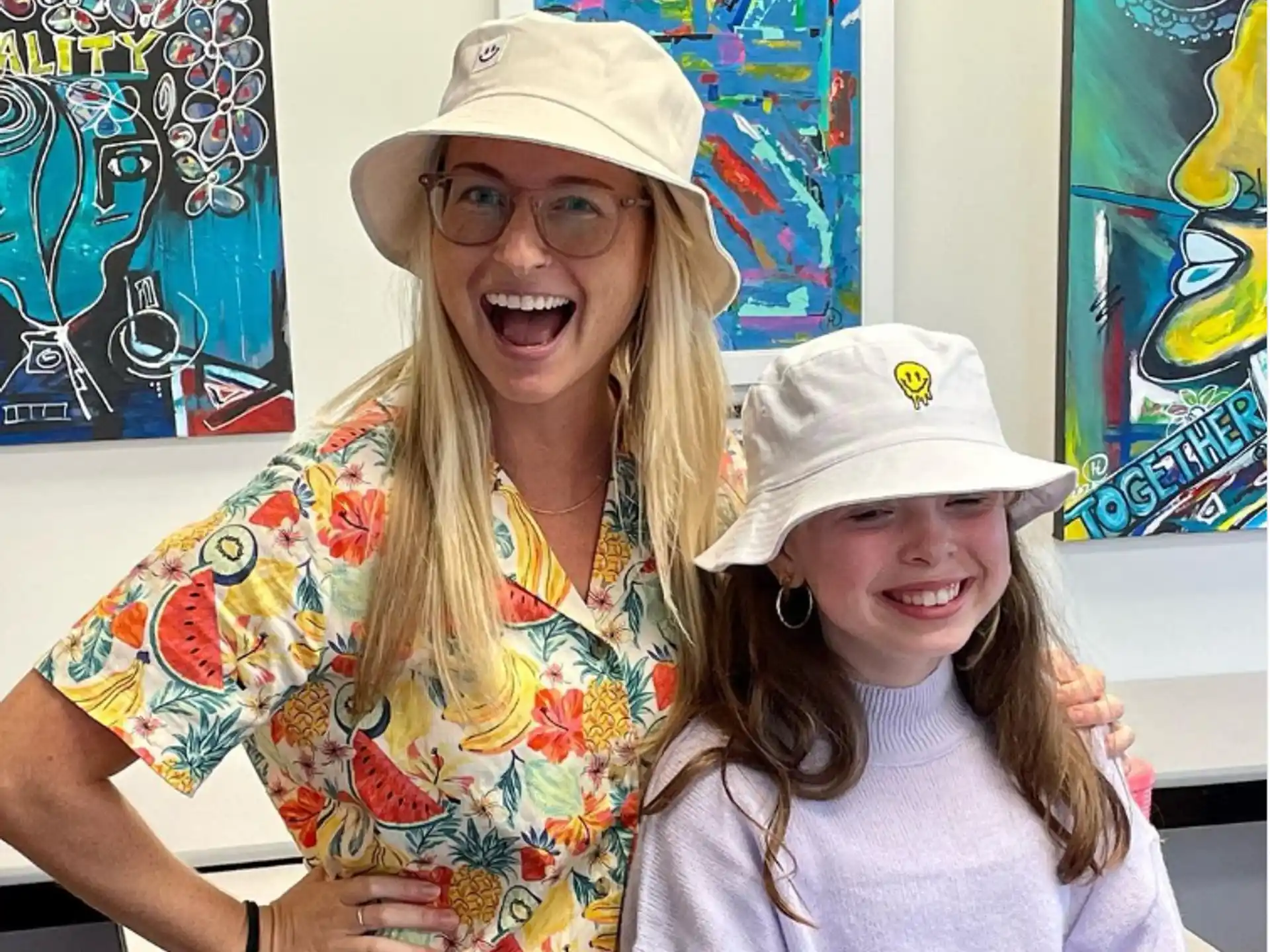 a person and a girl wearing hats
