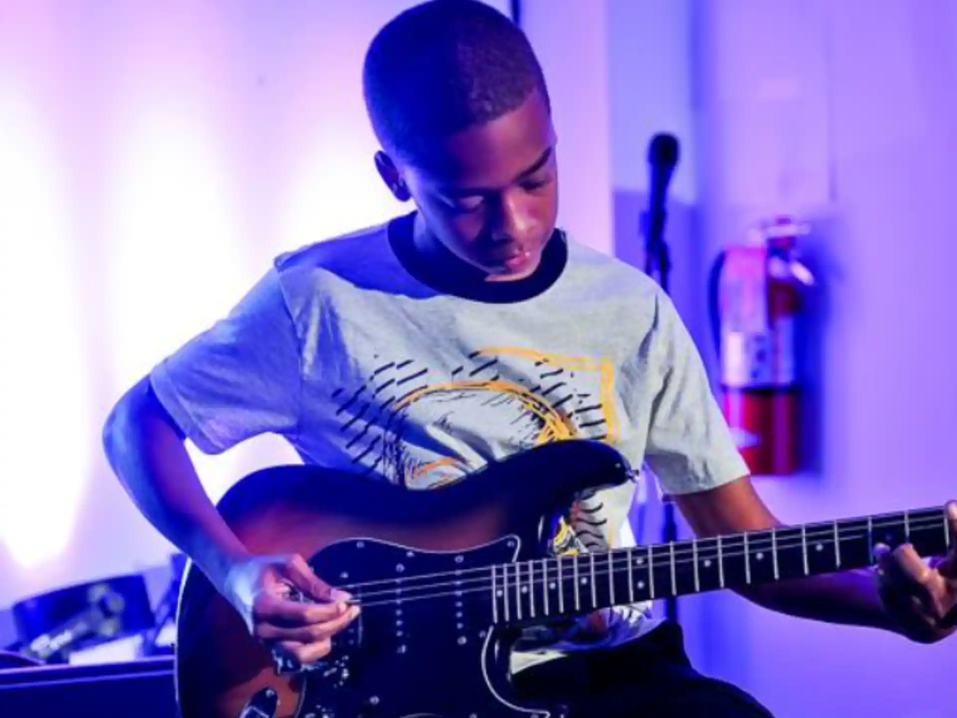 a man playing a guitar