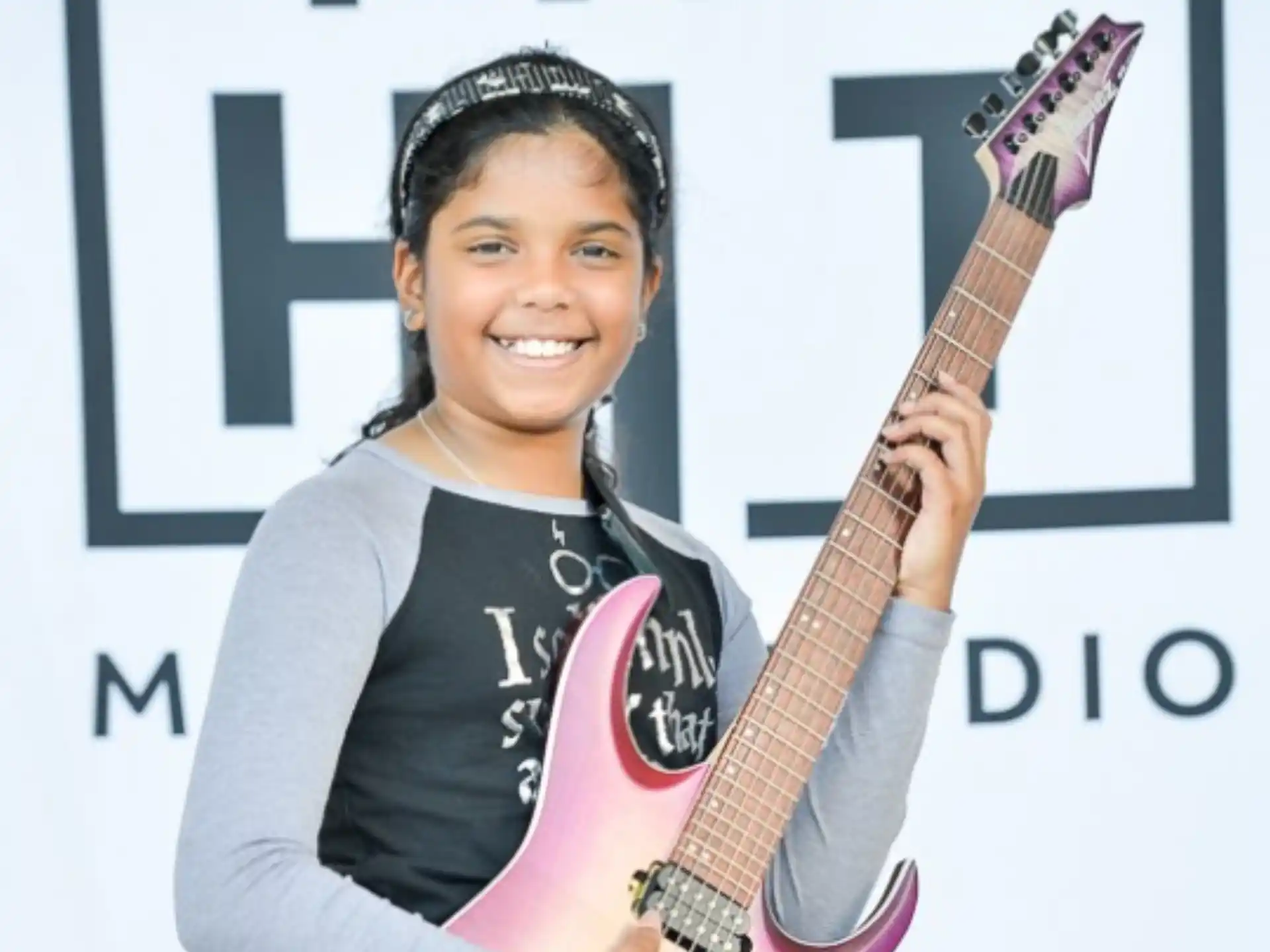 a woman holding a guitar