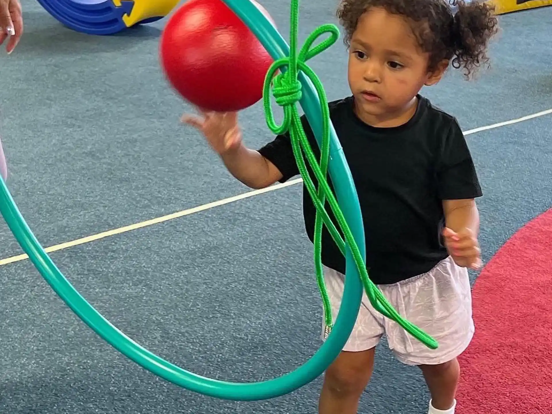 a child playing with a ball