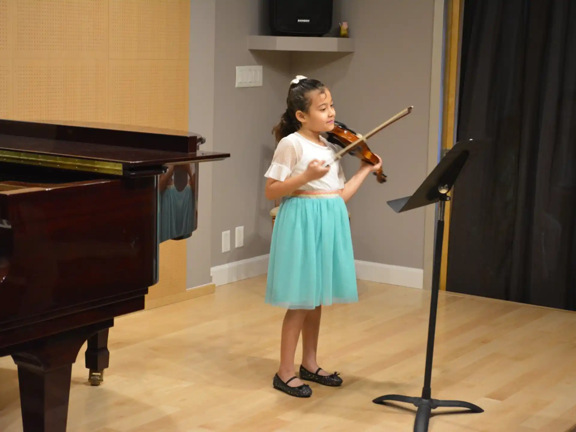 a girl playing a violin