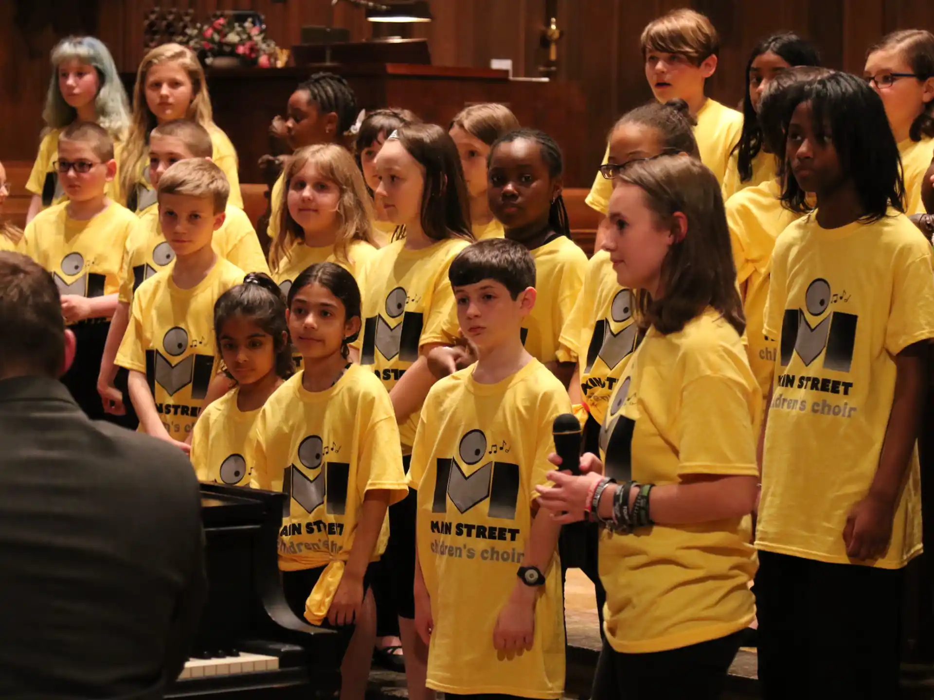 a group of people wearing yellow t-shirts