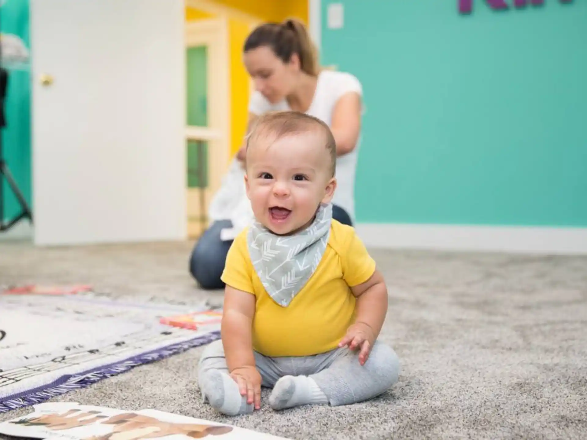a baby sitting on the floor