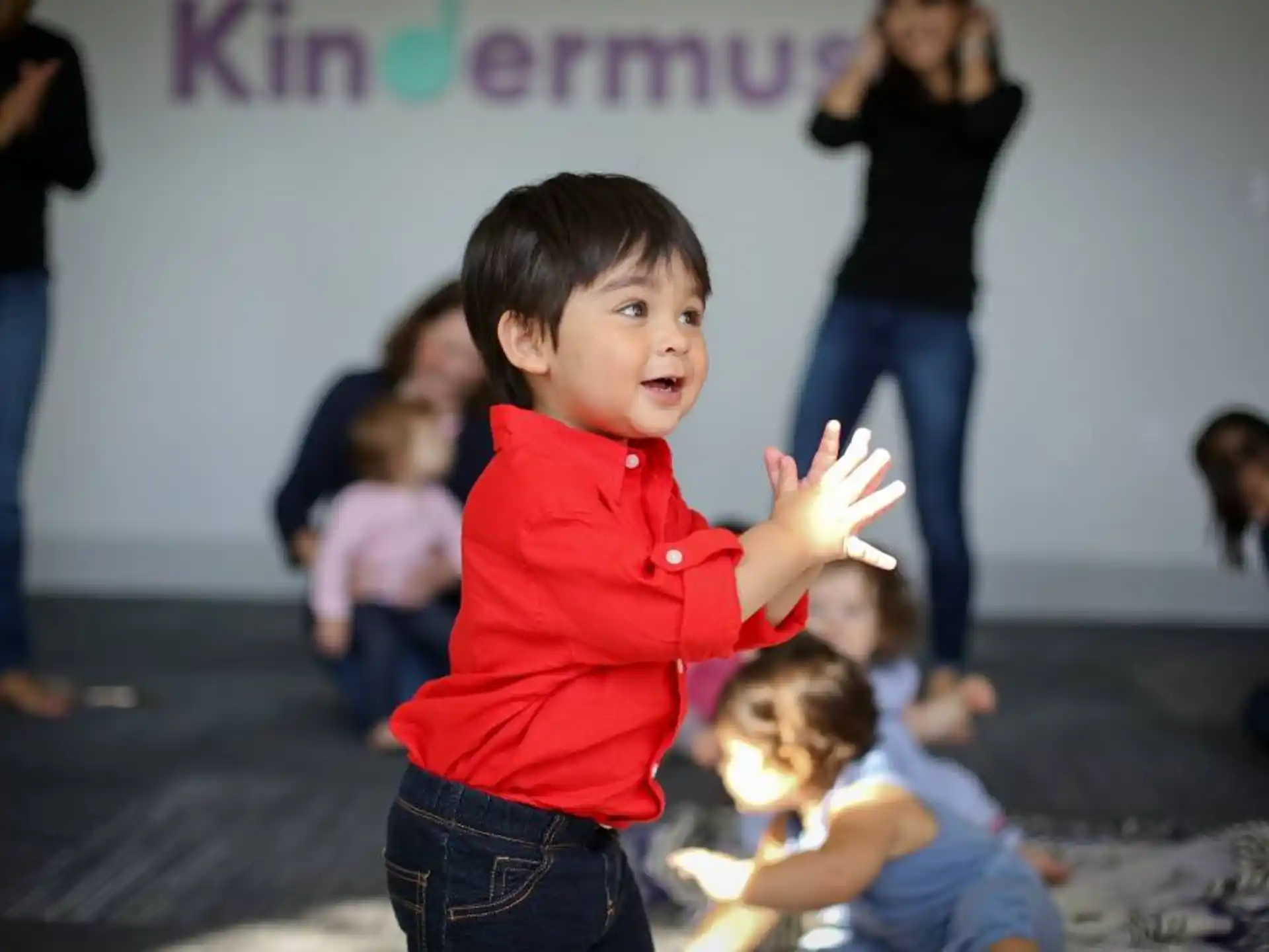 a boy in a red shirt