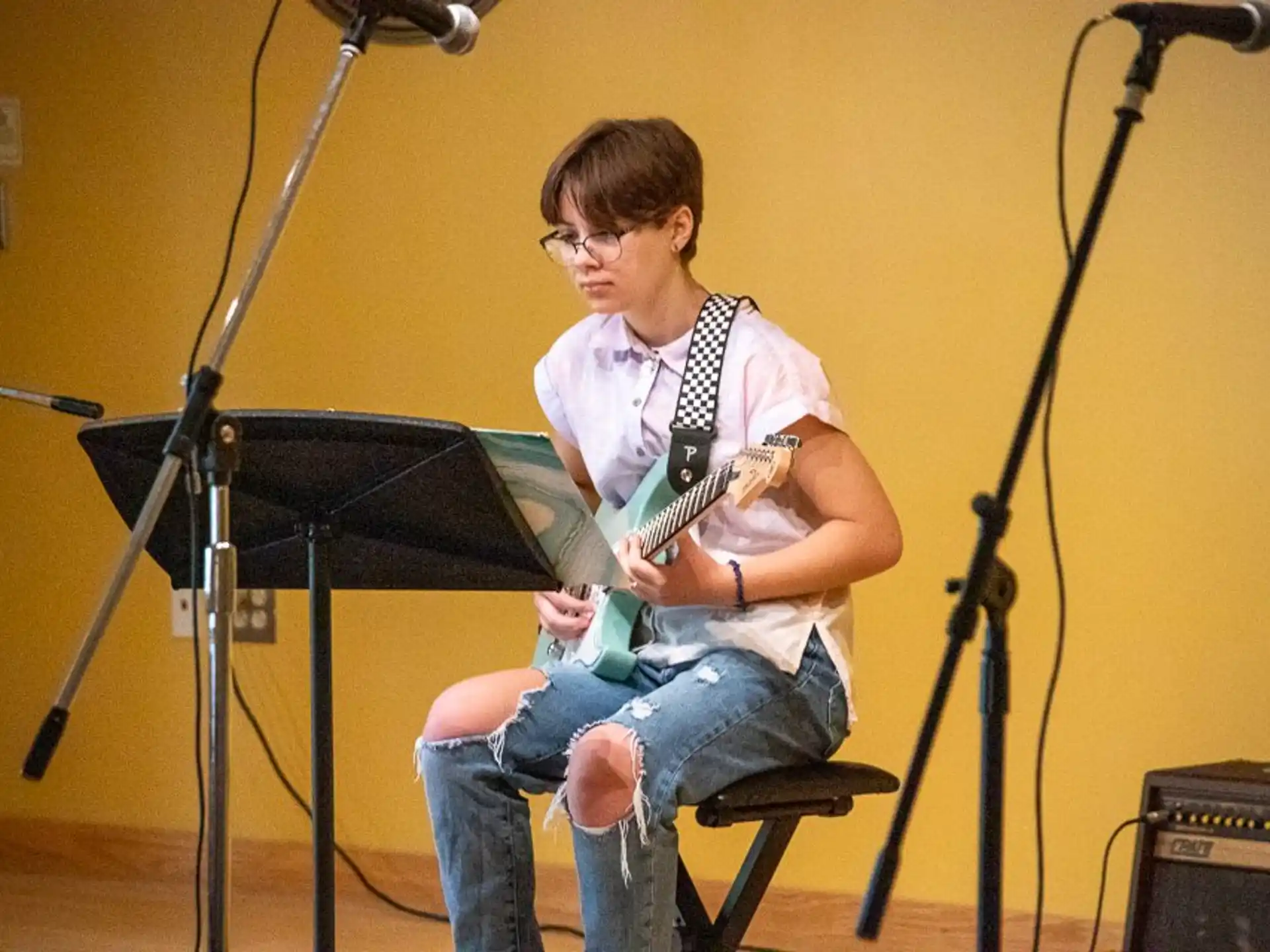 a man playing a guitar