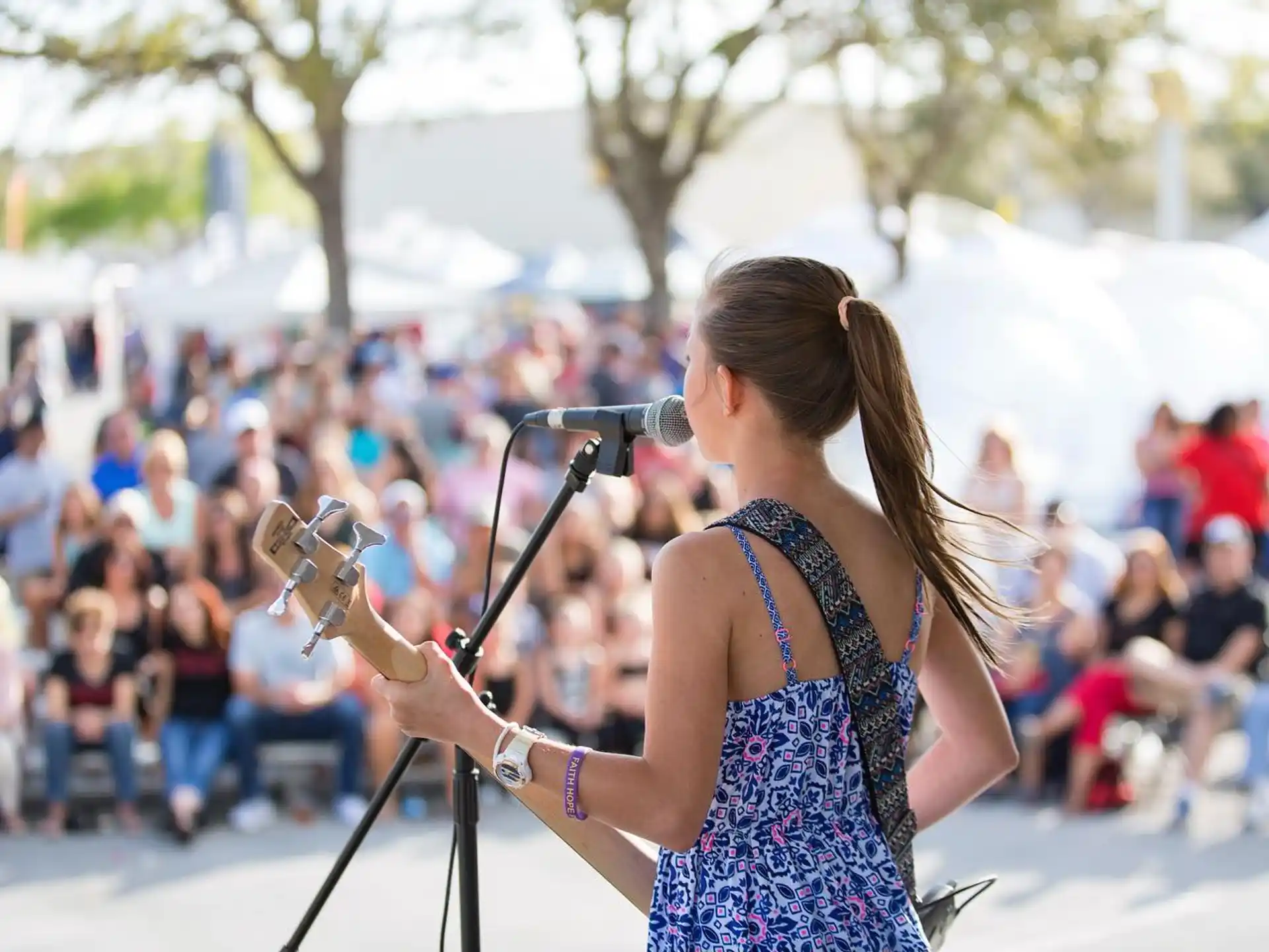 a woman playing a violin
