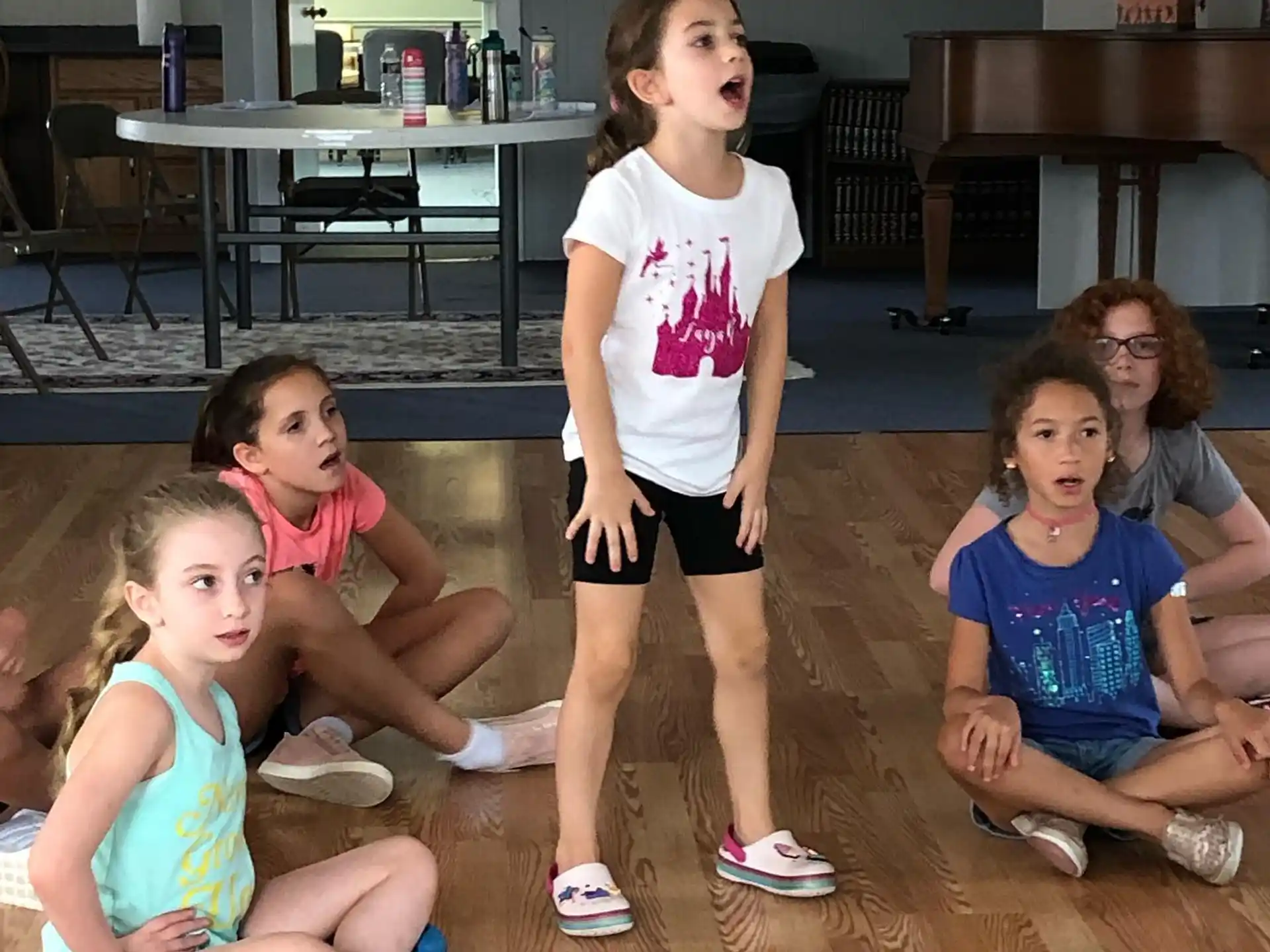 a group of children sitting on the floor