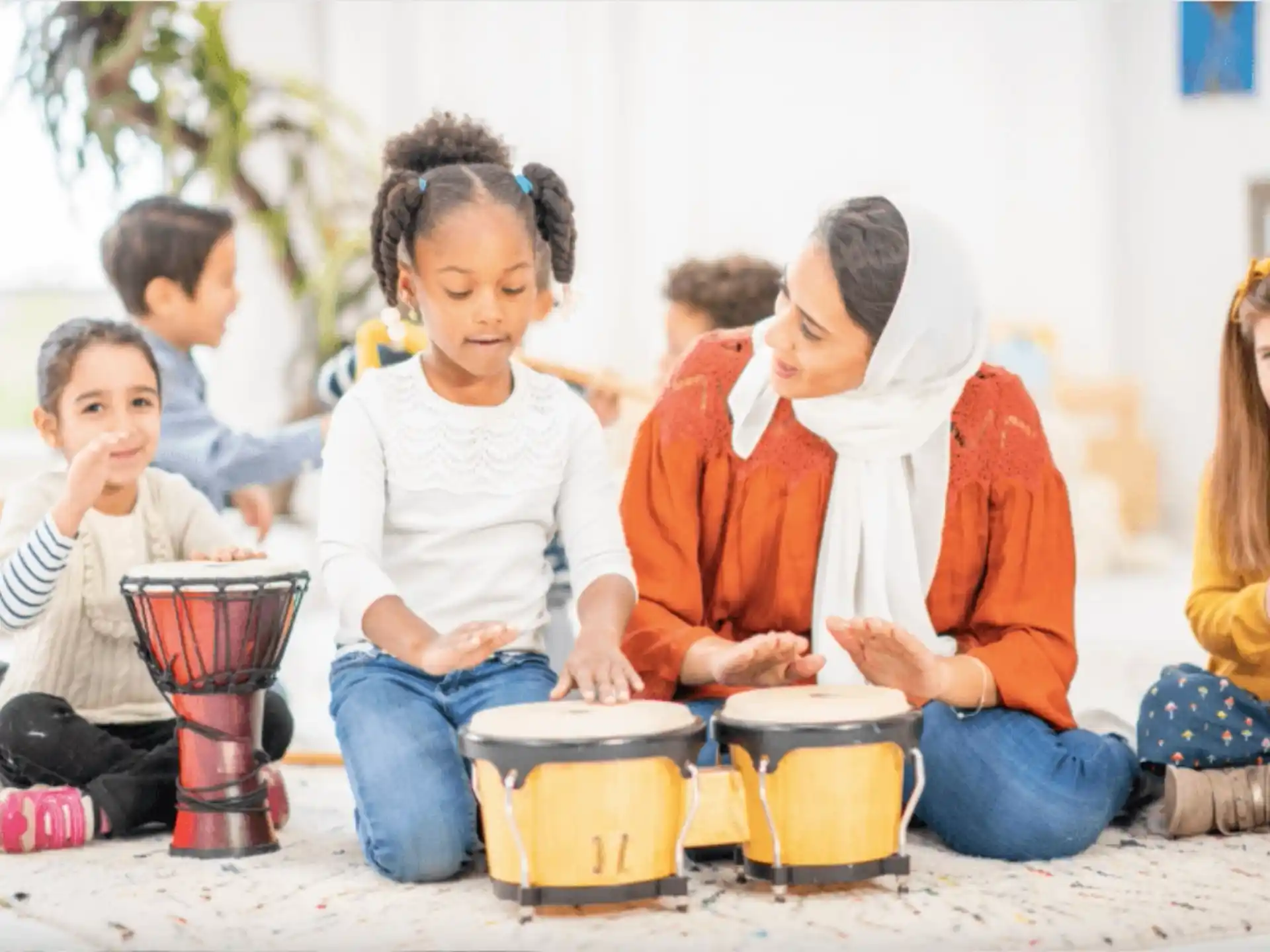 a group of children playing drums