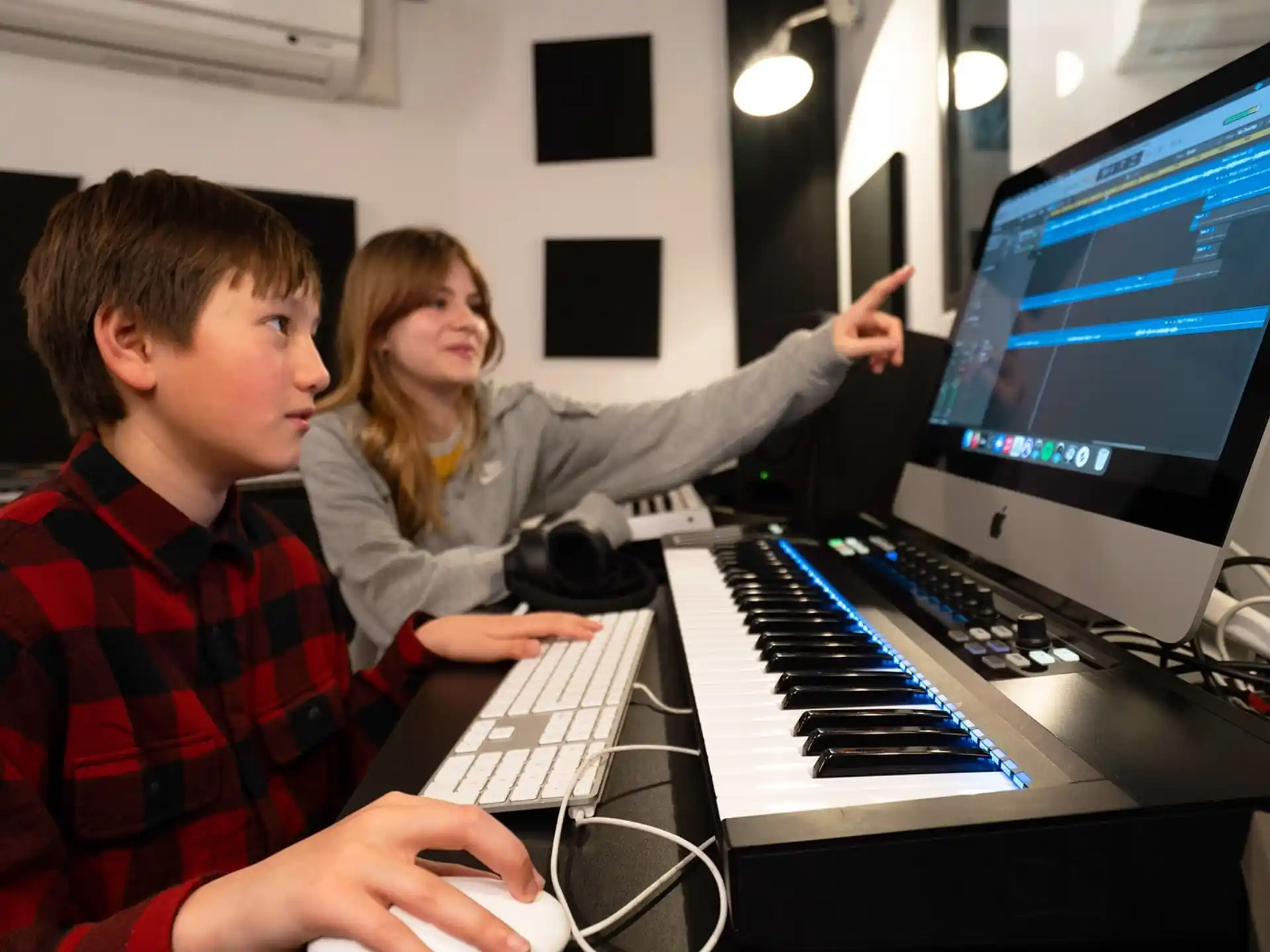 a man and a woman using a computer