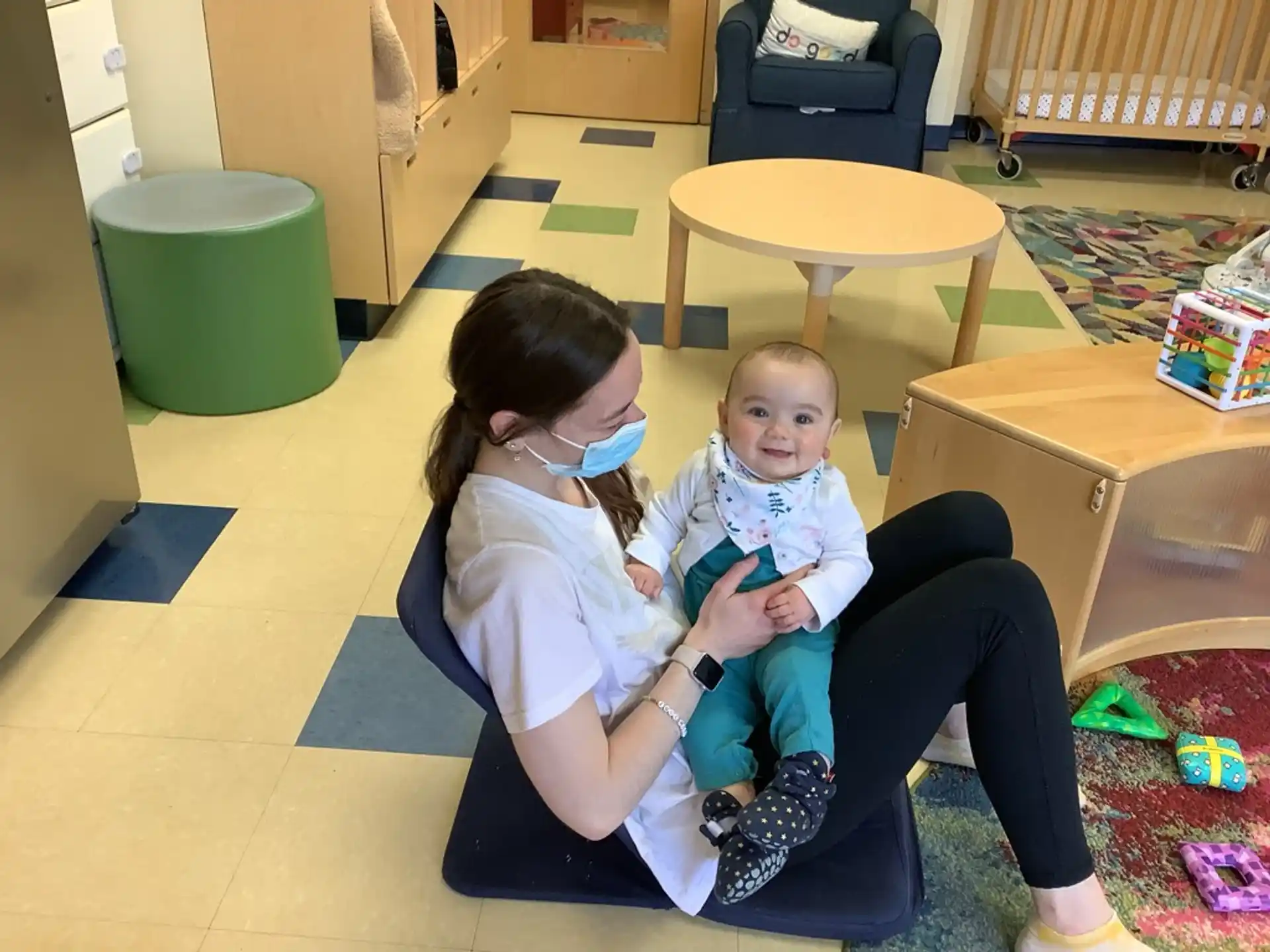 a person holding a baby