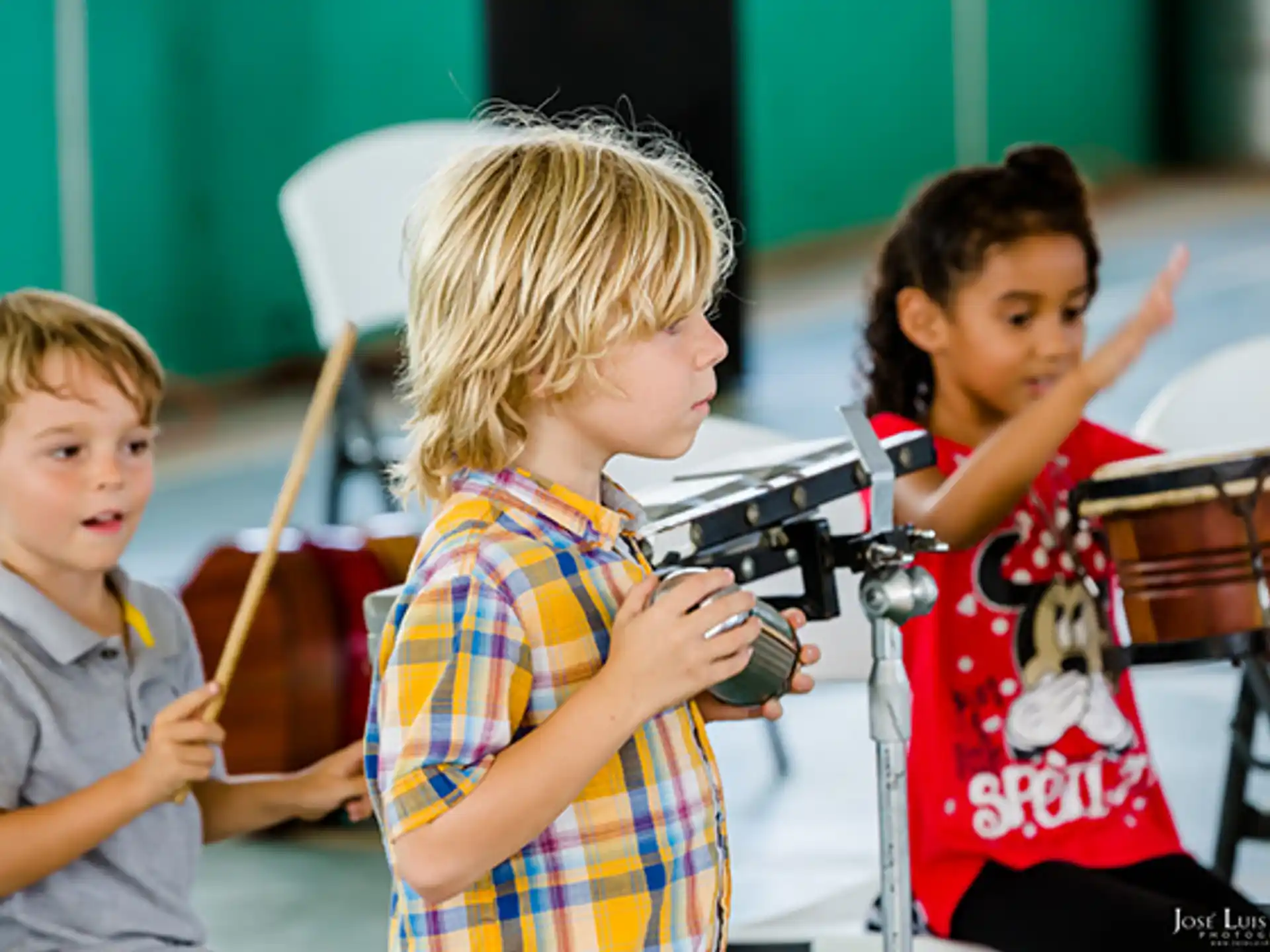 a group of kids playing instruments