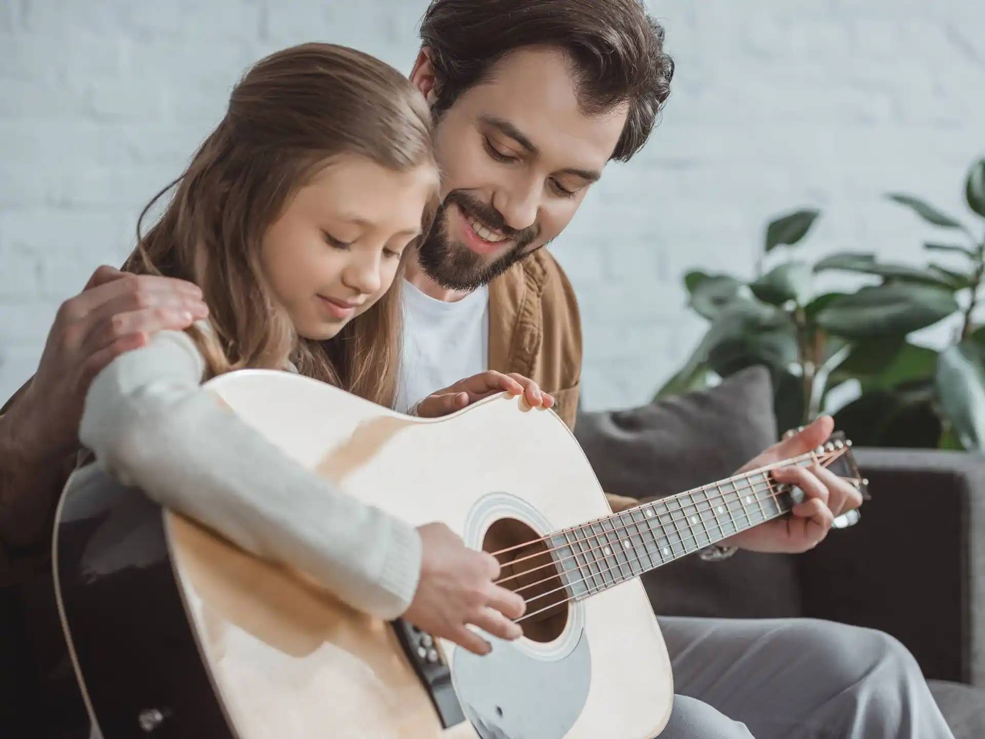 a man and woman playing guitar