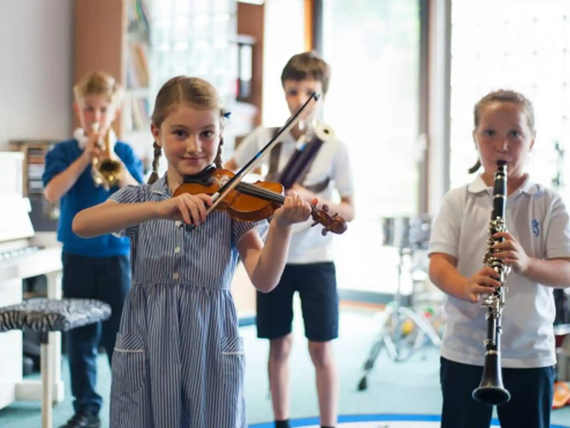 a group of kids playing instruments