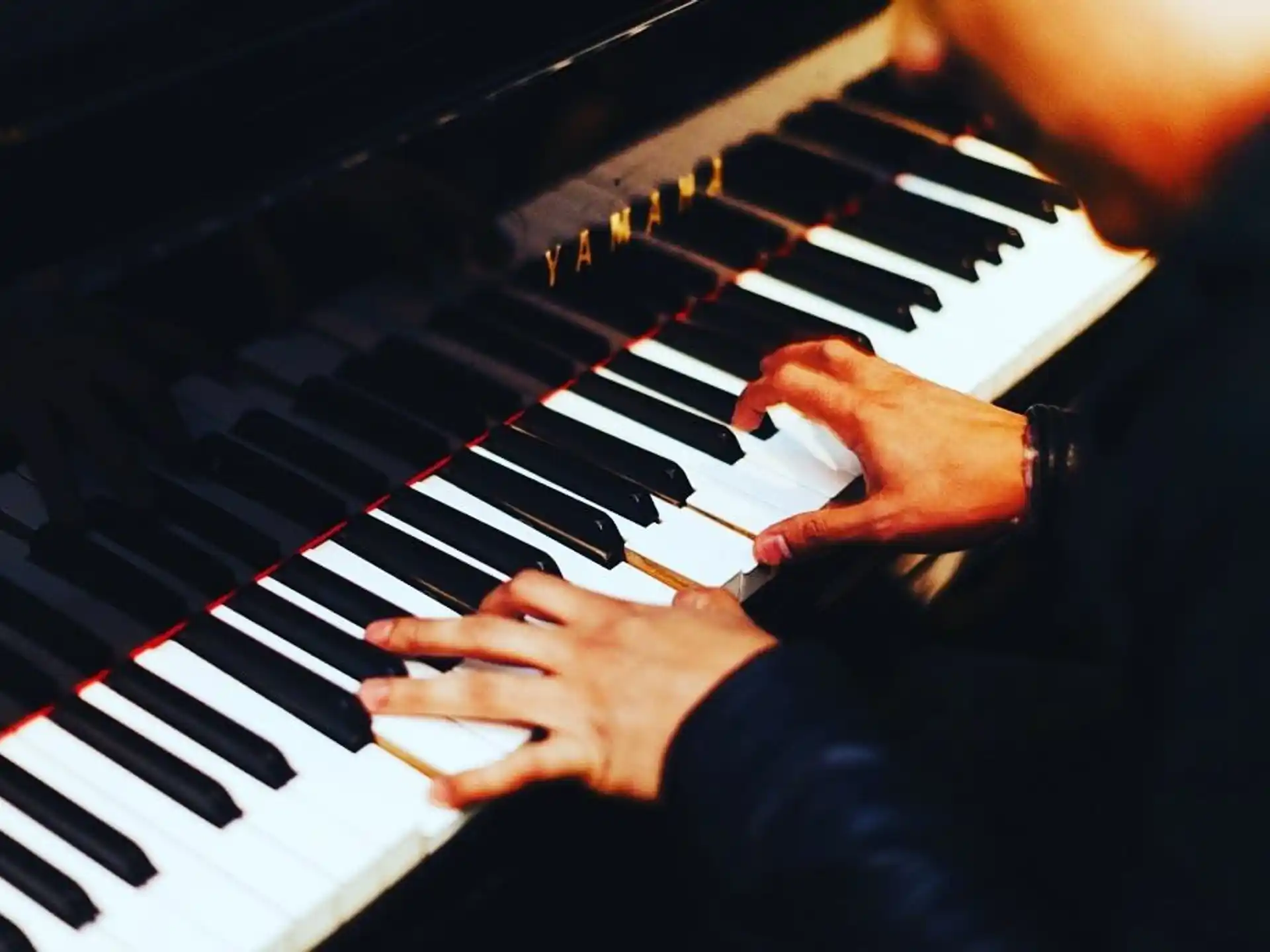 a person playing a piano