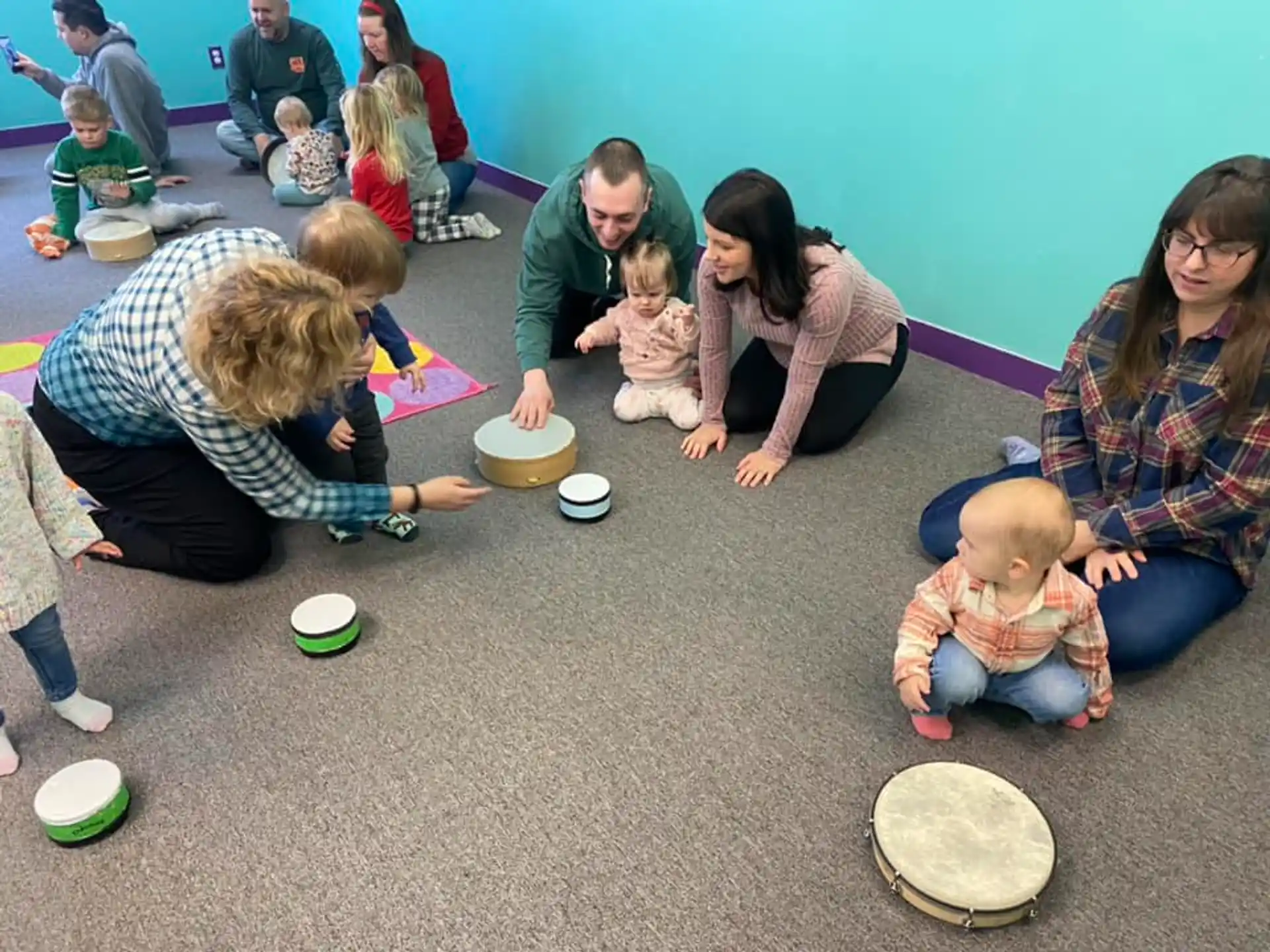a group of people sitting on the floor