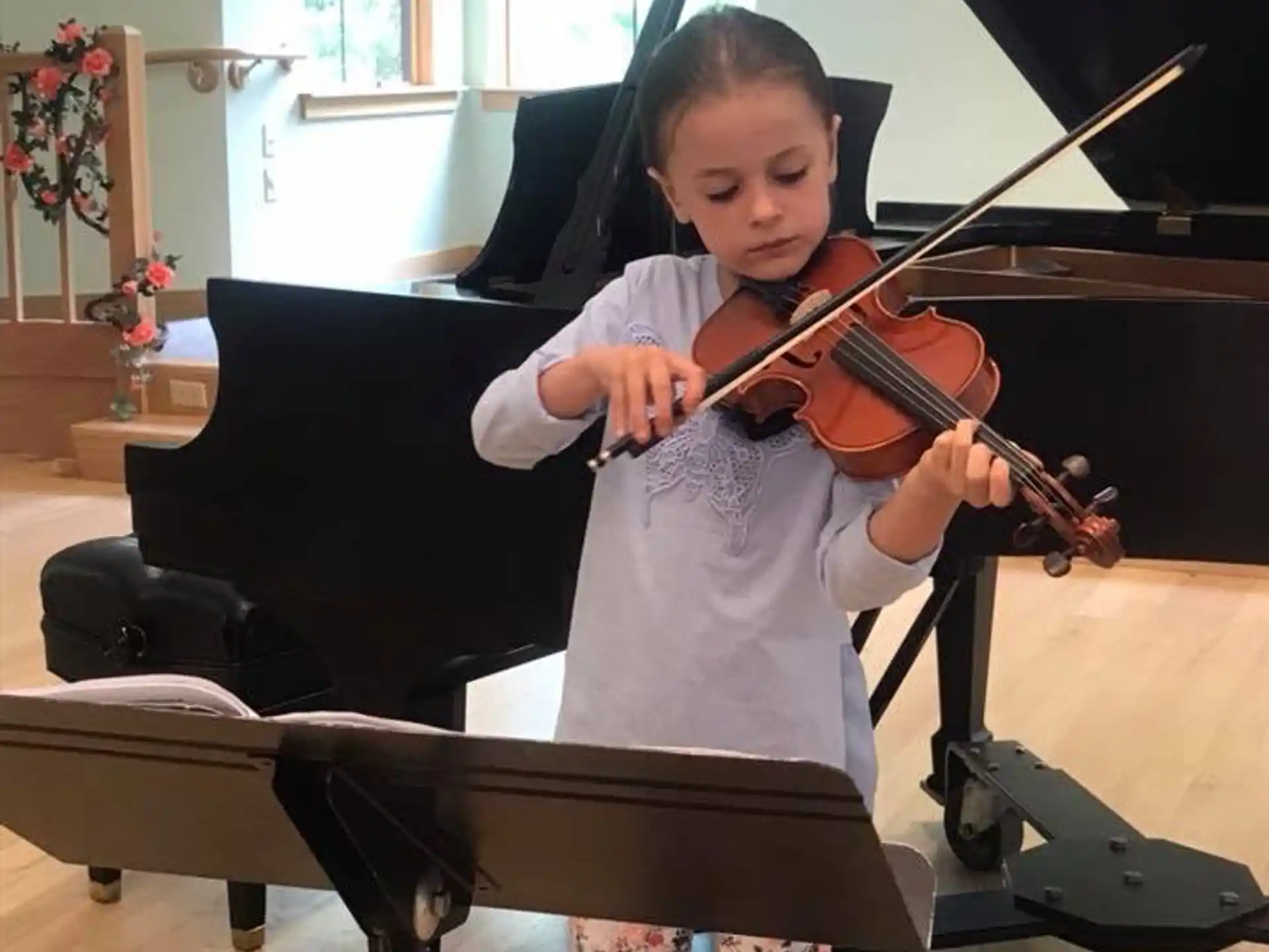 a girl playing a violin