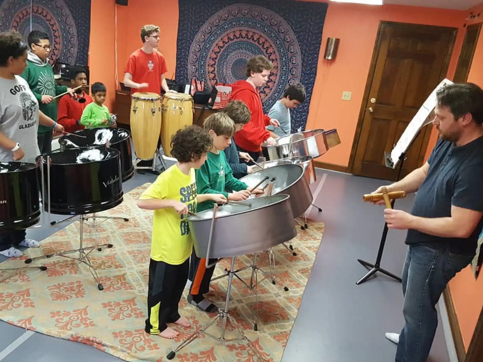a group of people playing drums