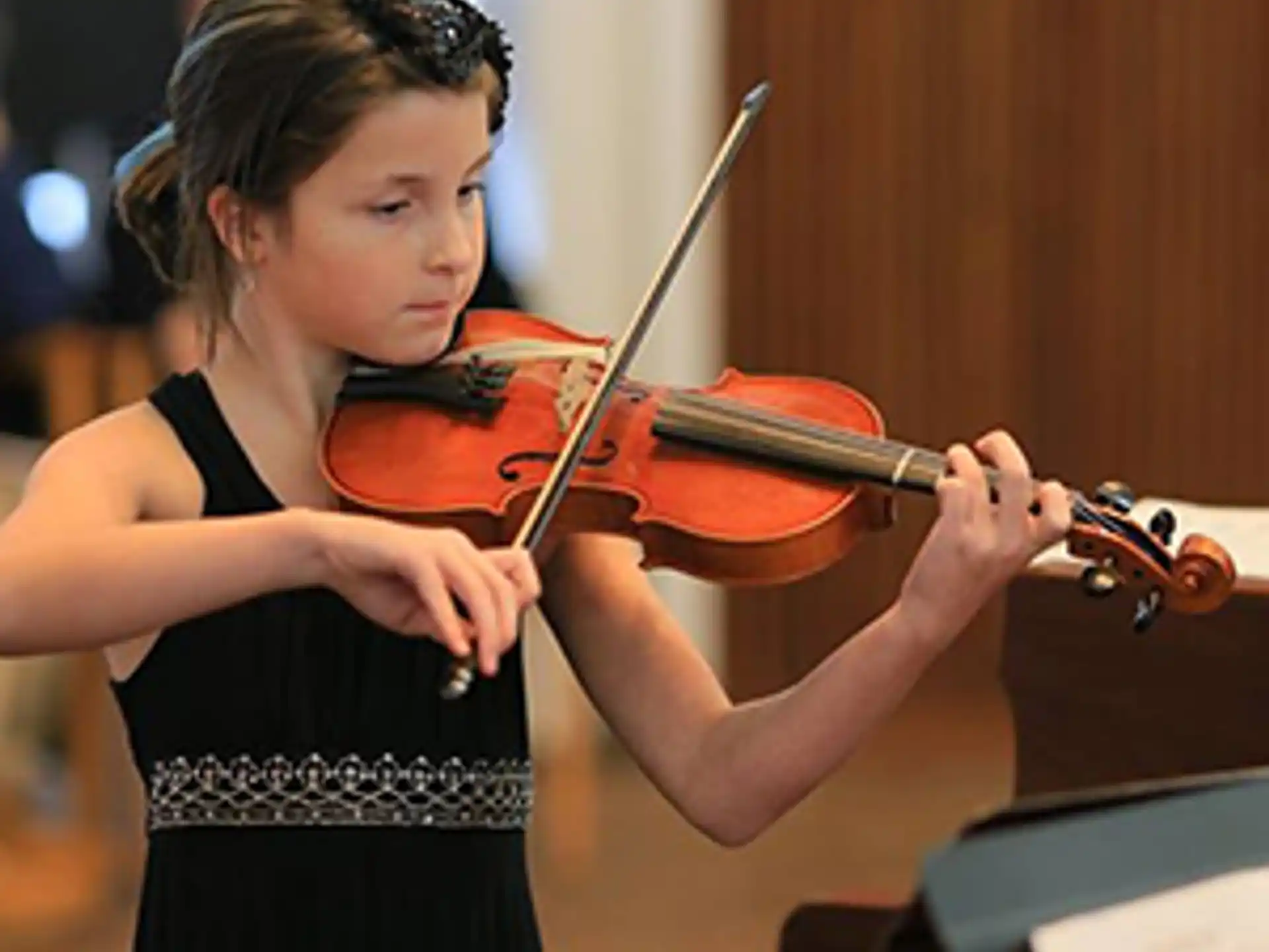 a girl playing a violin