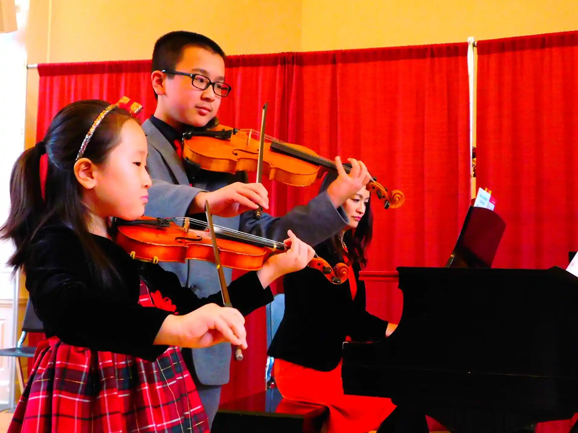 a man and a woman playing violin