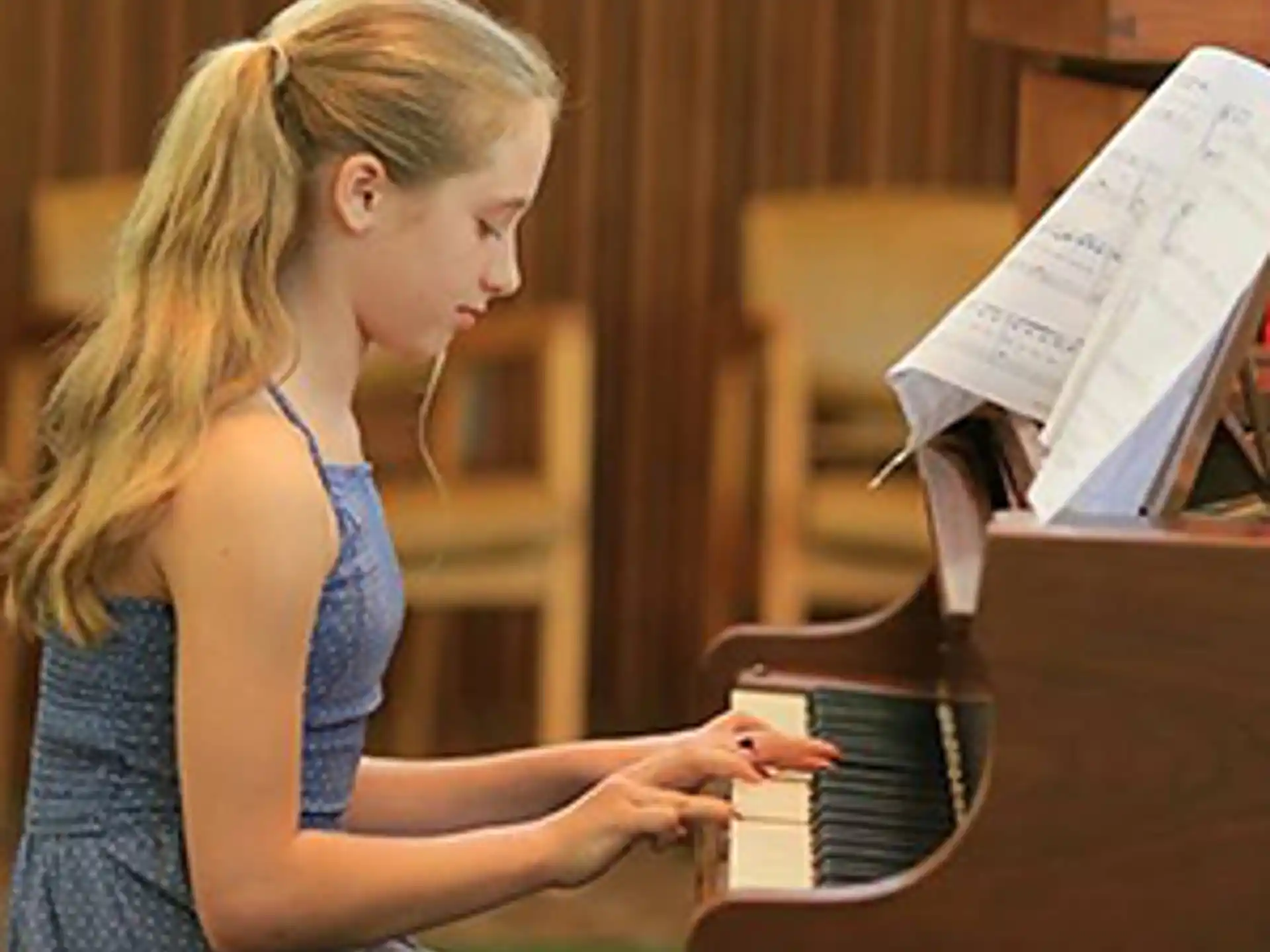 a woman playing a piano