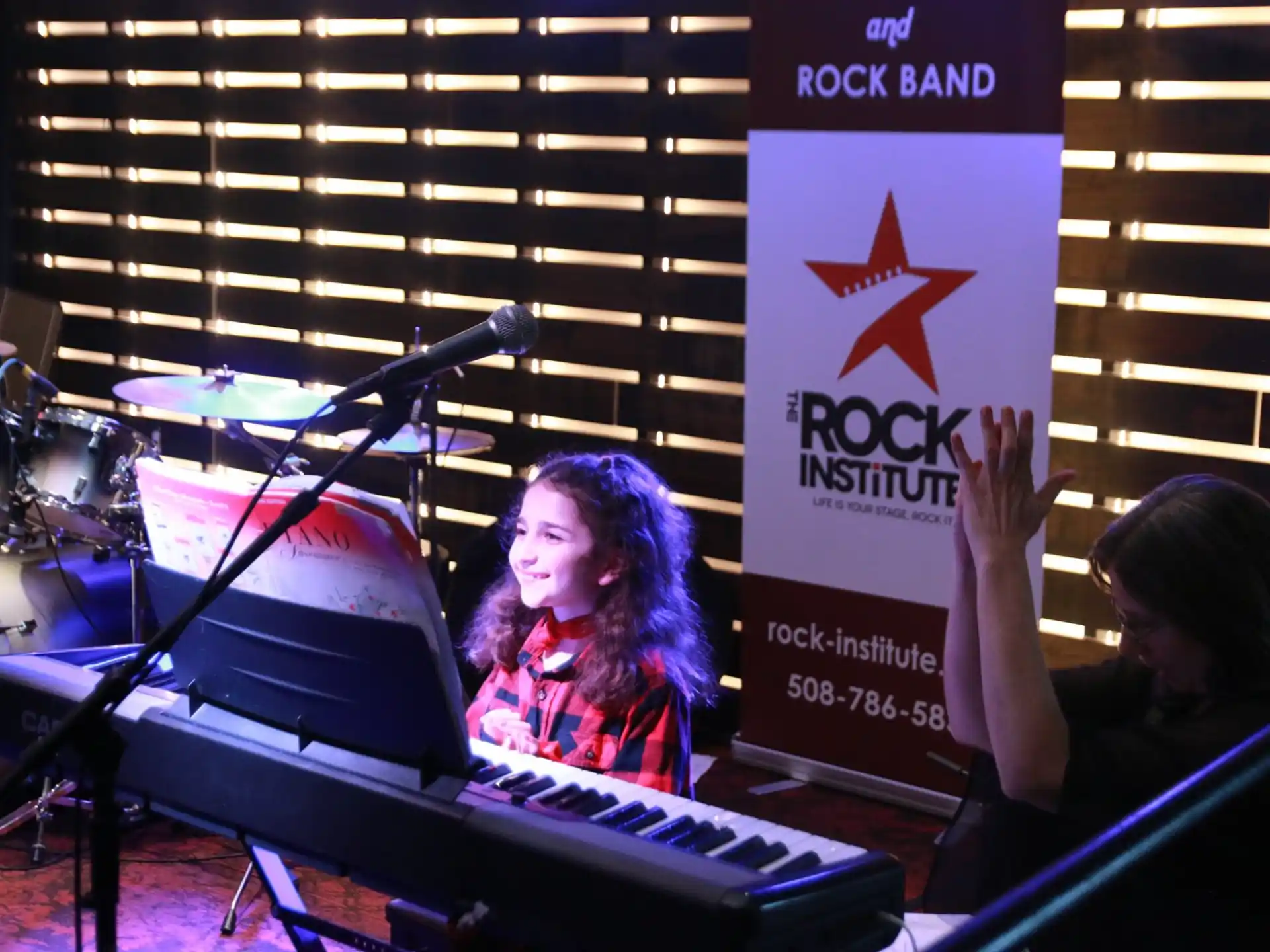 a person sitting at a piano