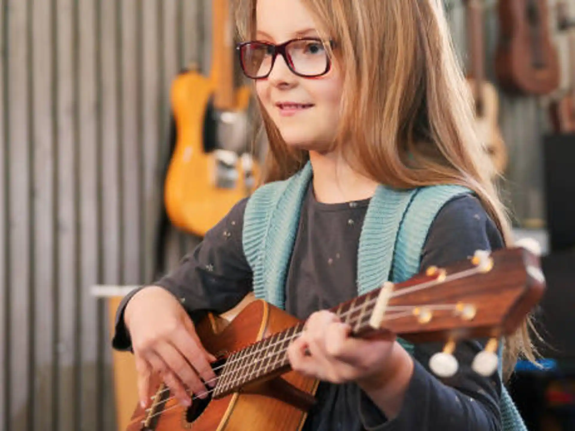 a woman playing a guitar