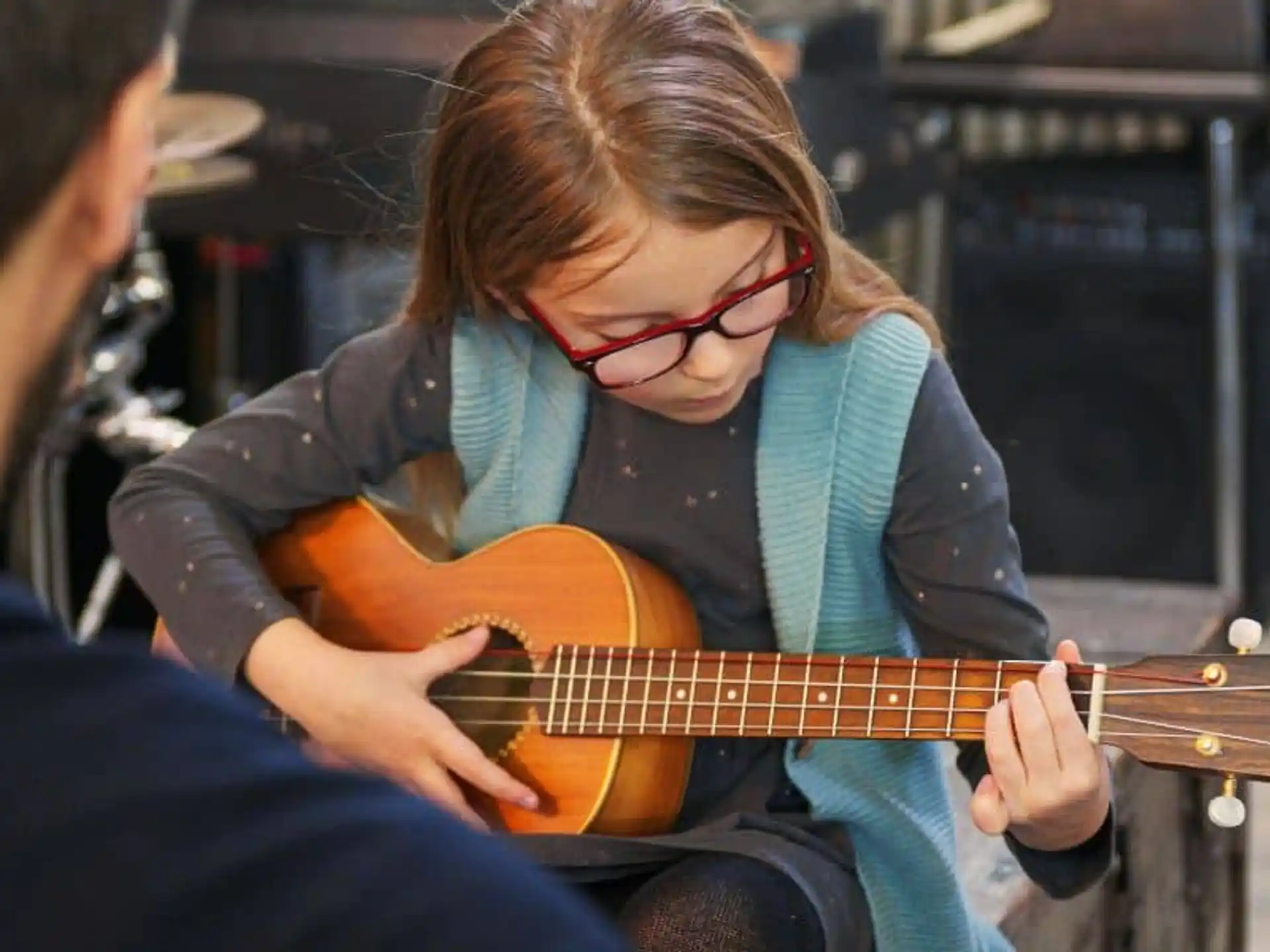 a woman playing a guitar