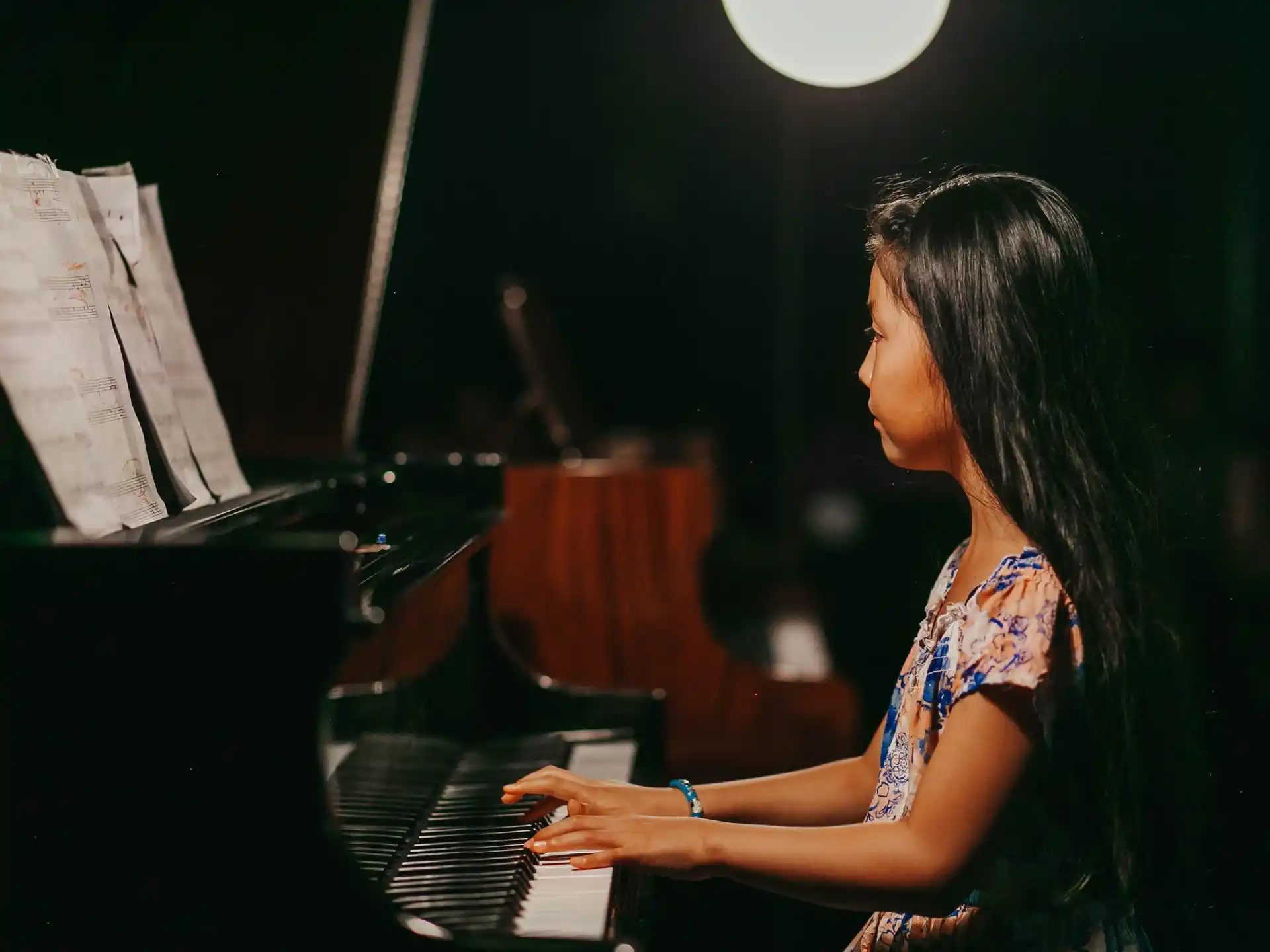 a woman playing the piano