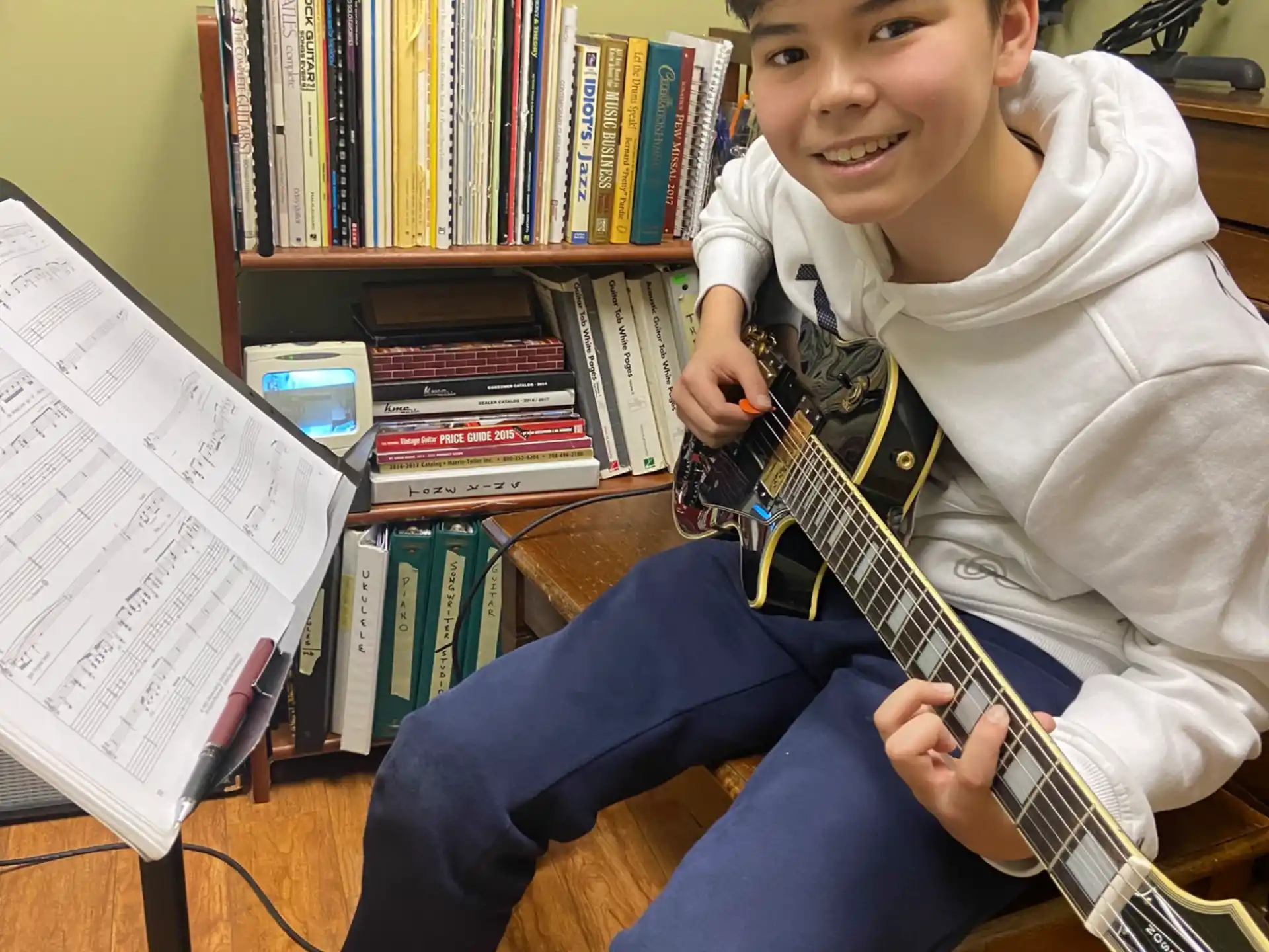 a boy playing a guitar