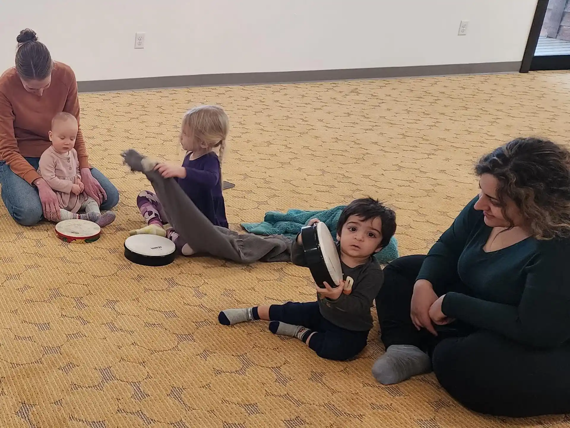 a group of people sitting on the ground