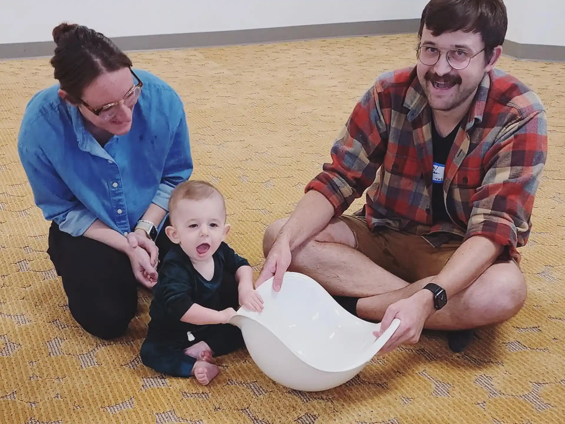 a man and a woman with a baby