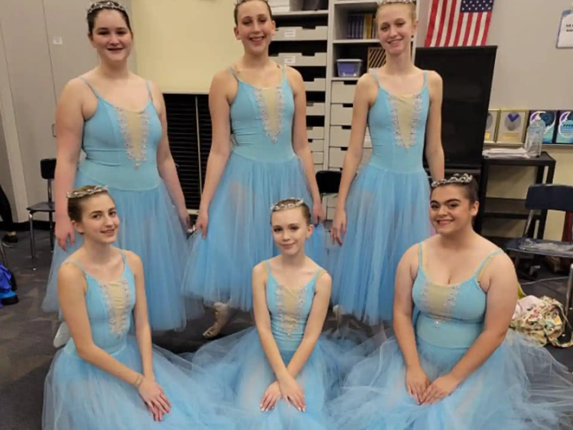 a group of women in dresses