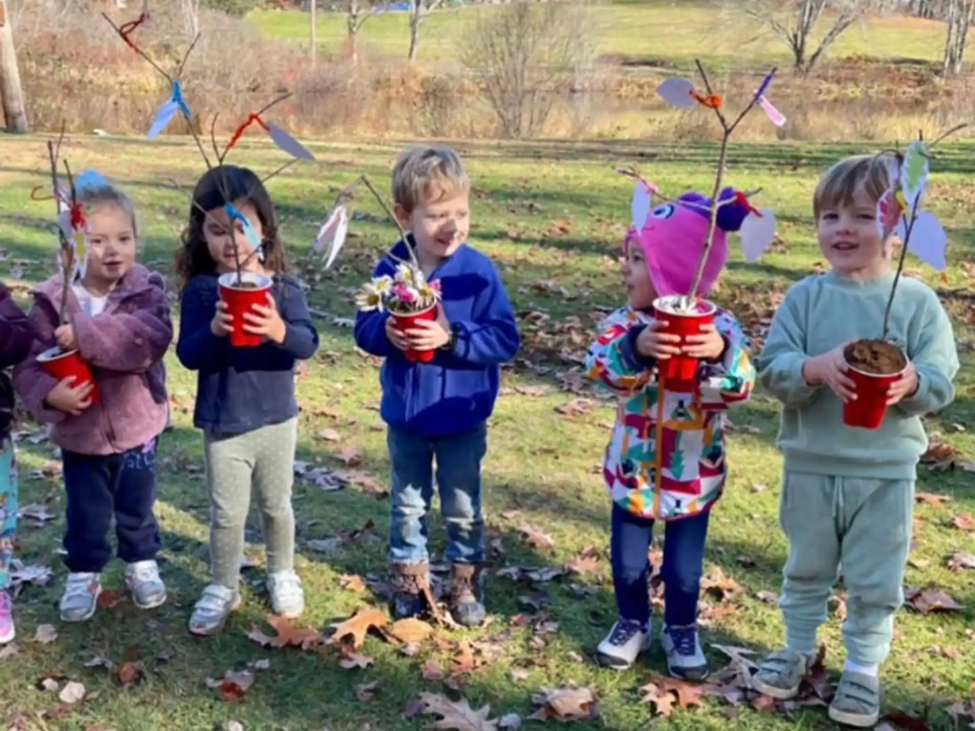 a group of children holding cups