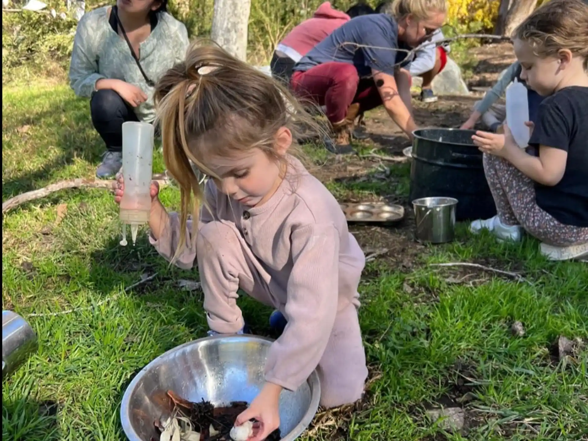 a group of people cooking outside