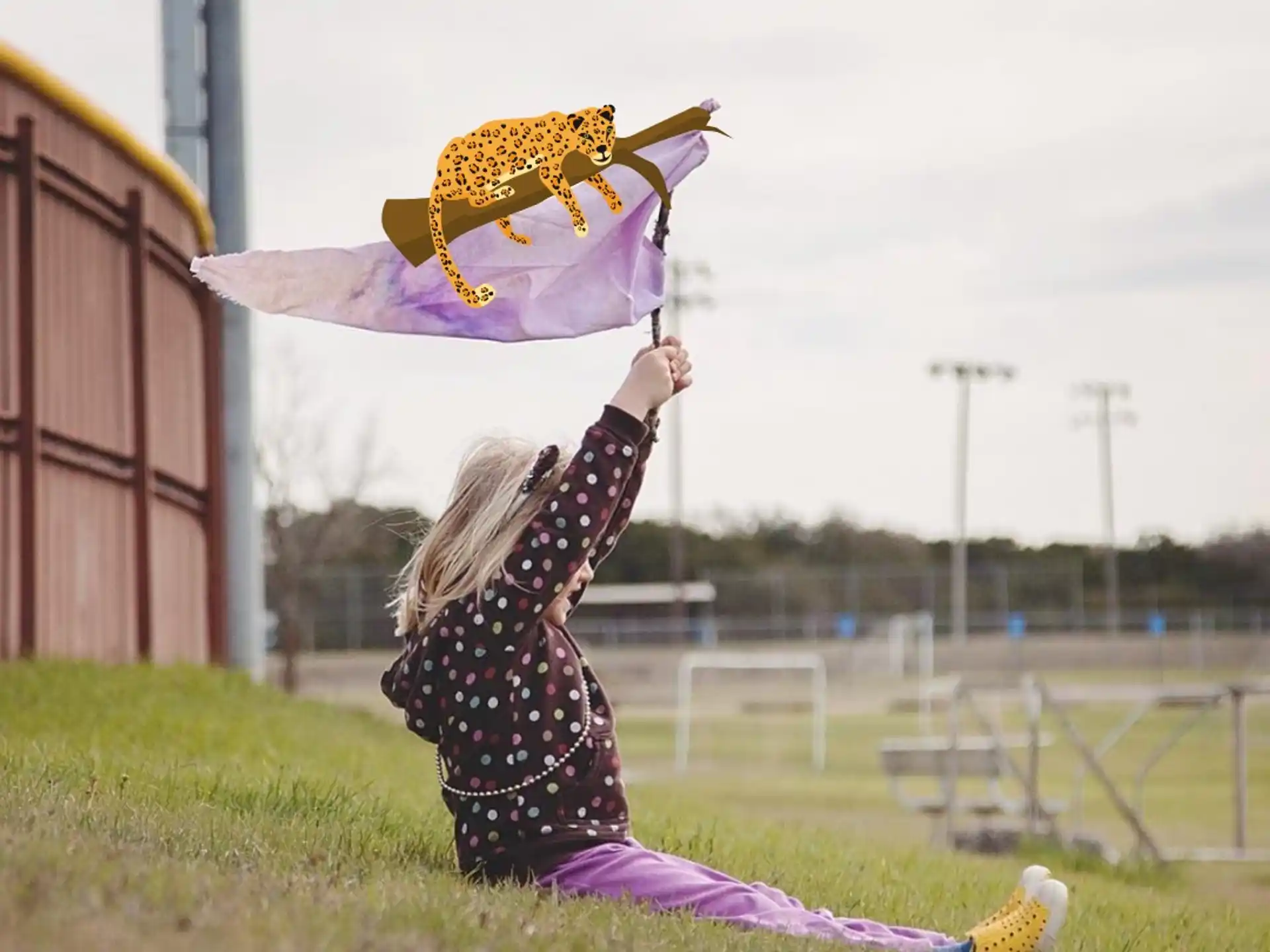 a person in a garment holding a kite