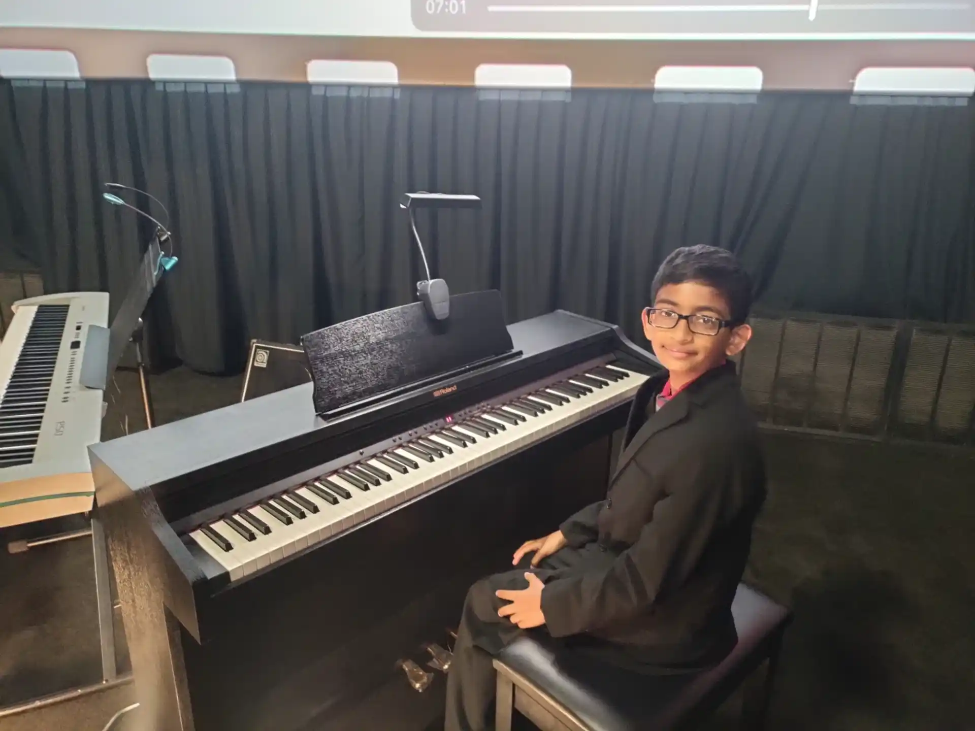 a man sitting at a piano