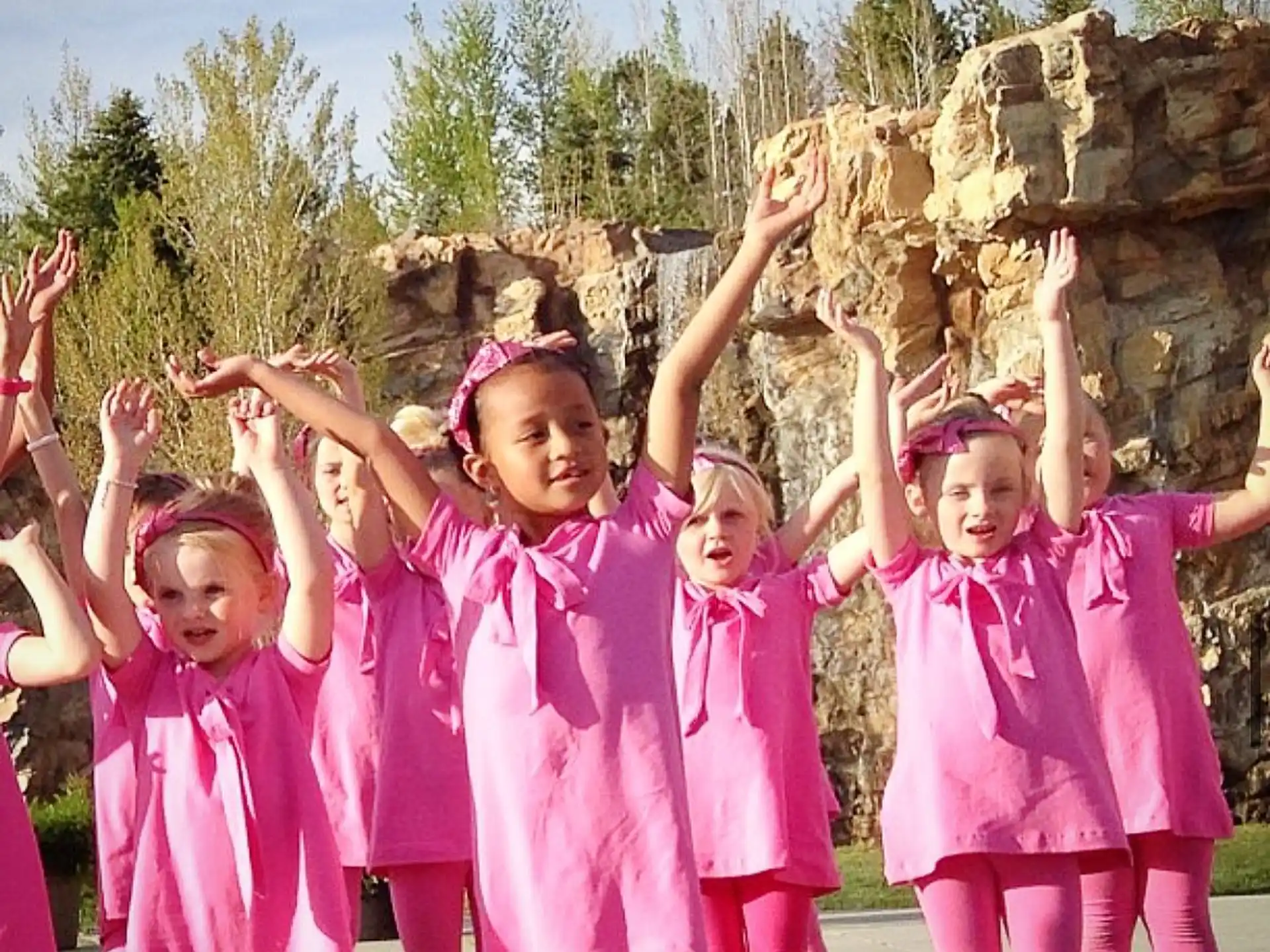 a group of girls in pink