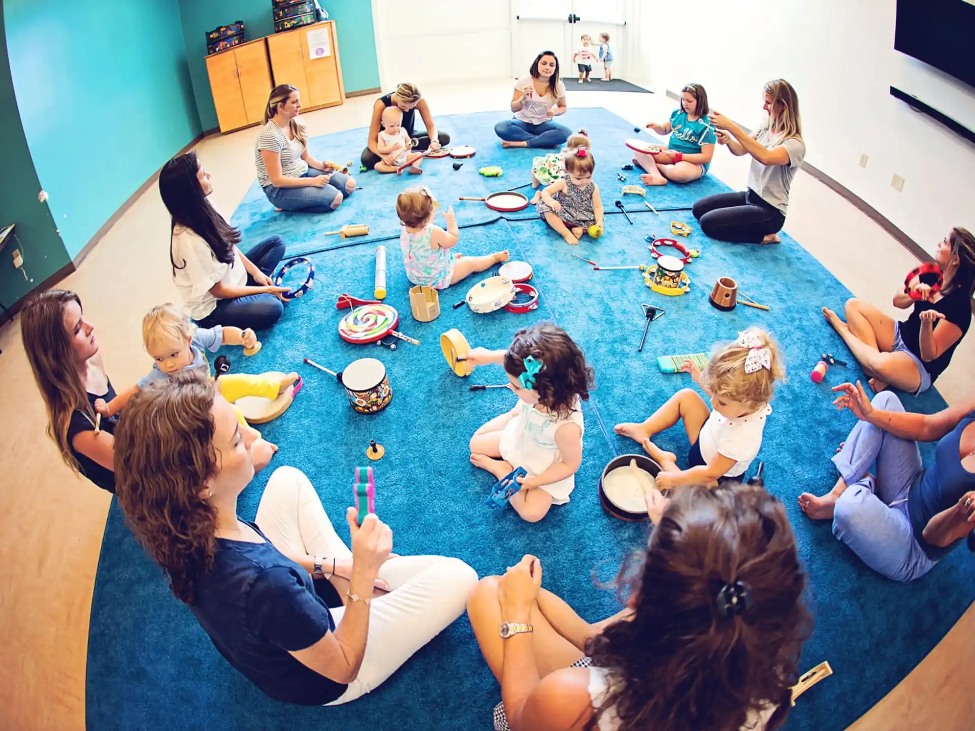 a group of people sitting on the floor
