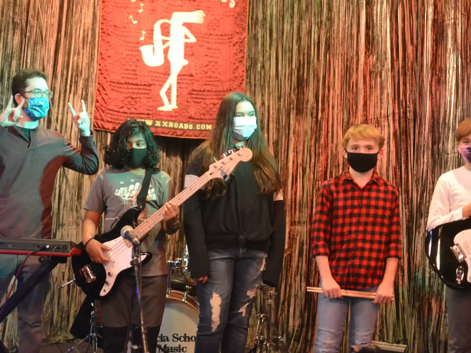 a group of people singing and playing instruments