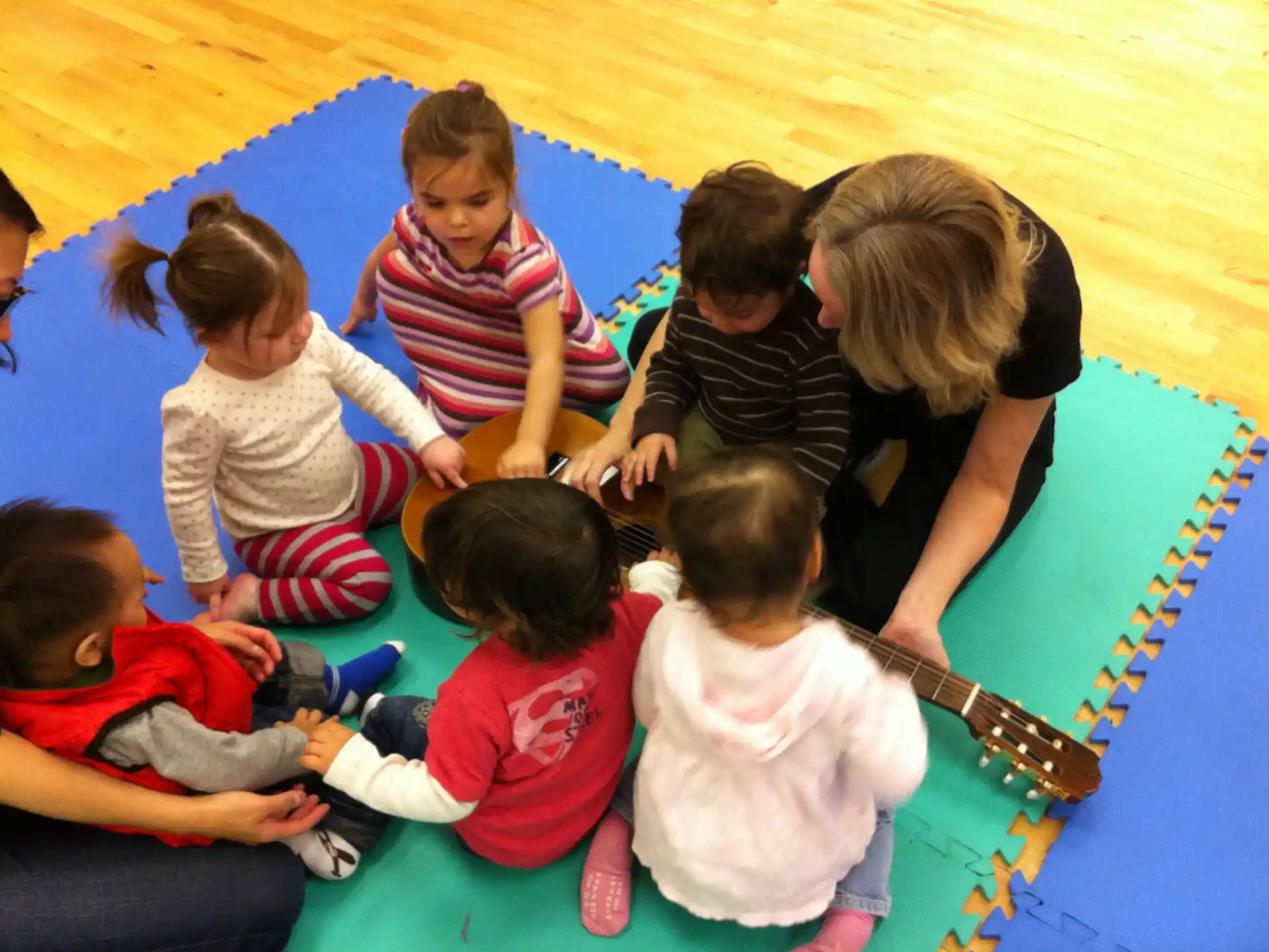 a group of children sitting on the floor