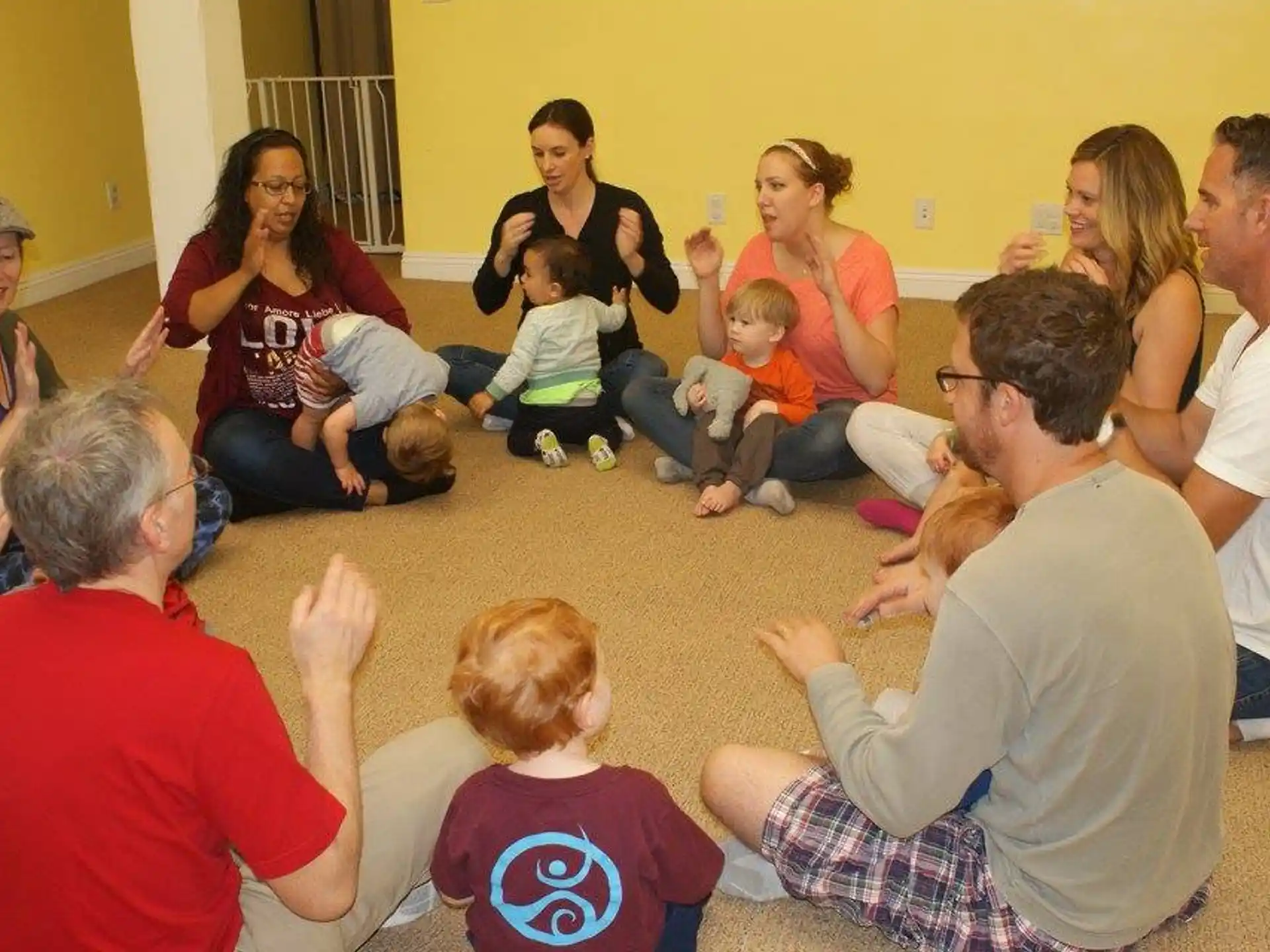 a group of people sitting on the floor
