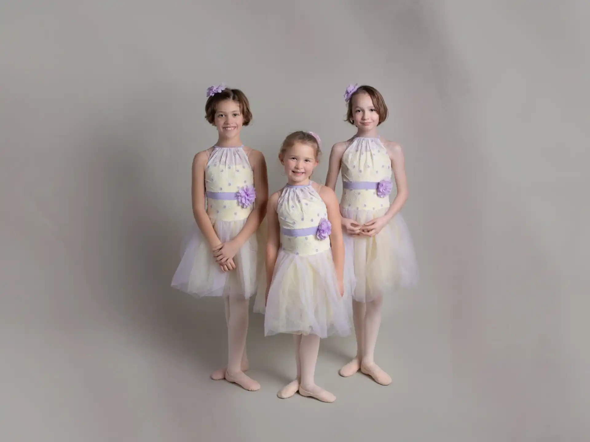 a group of girls wearing dresses