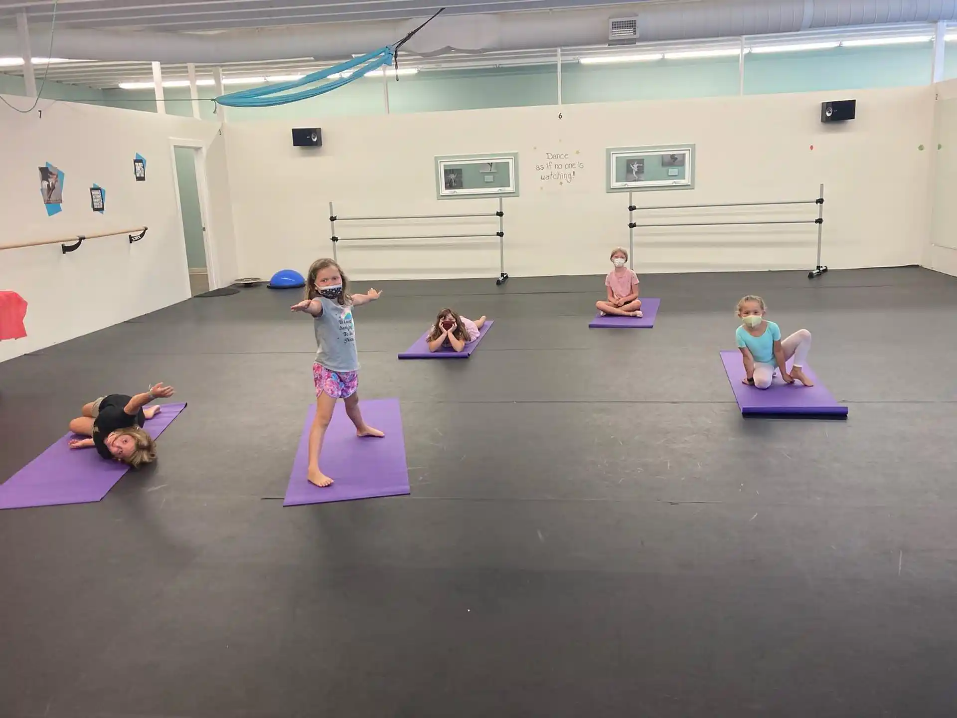 a group of people exercising in a gym
