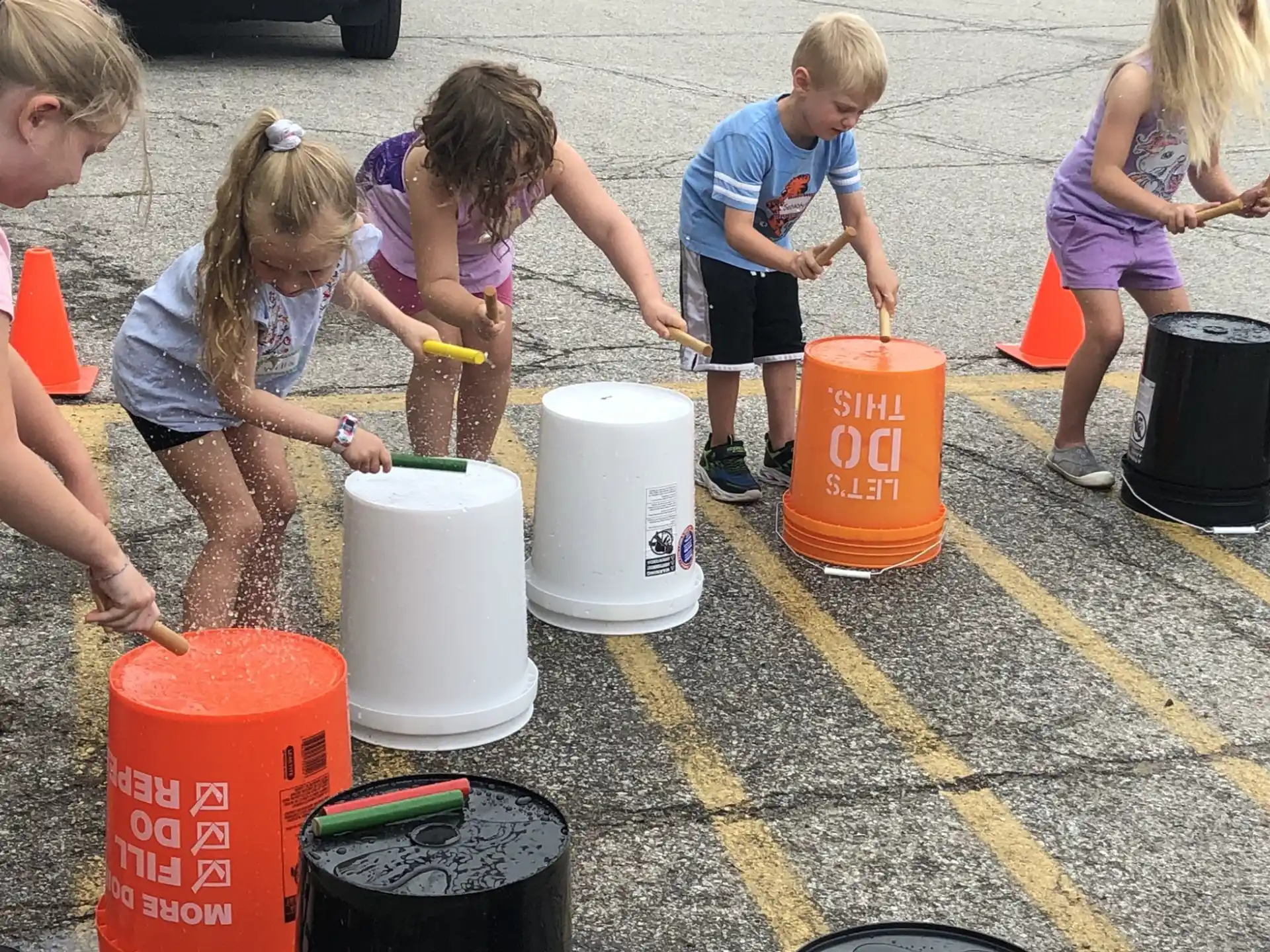 children playing with buckets