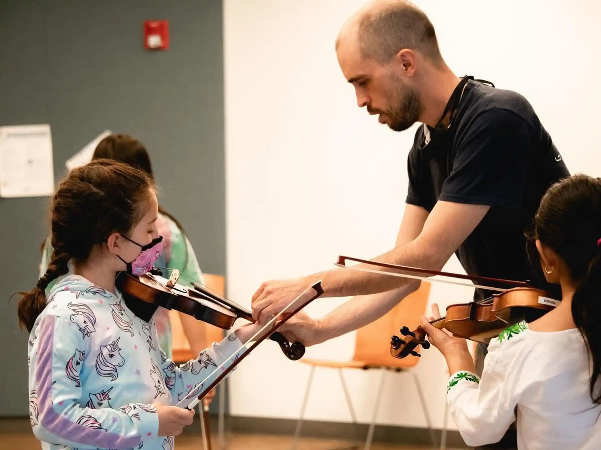 a person teaching a group of children