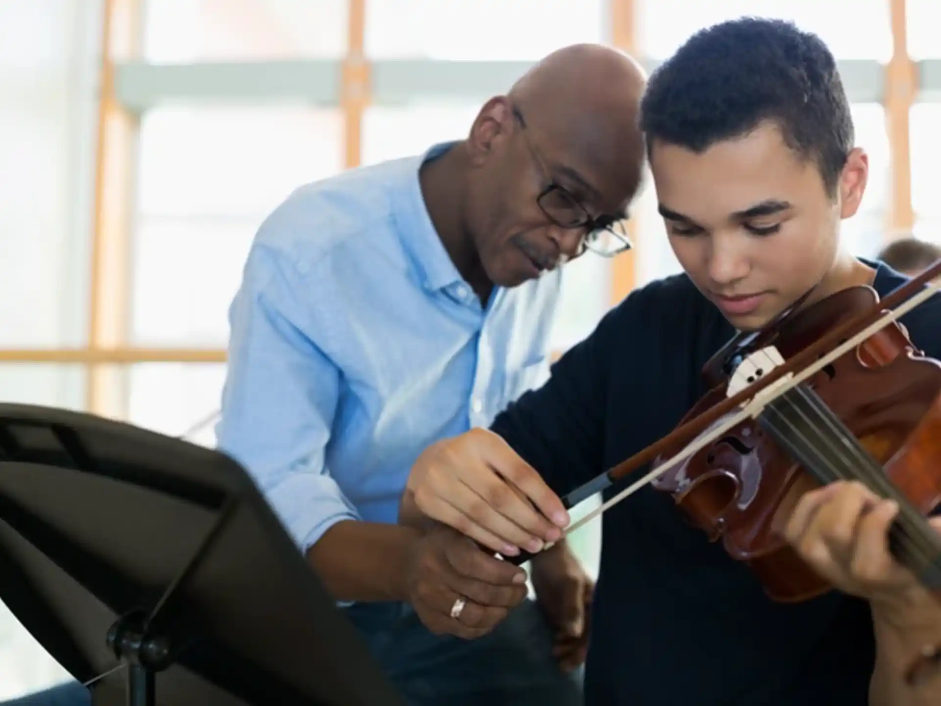 a man and a woman playing the violin
