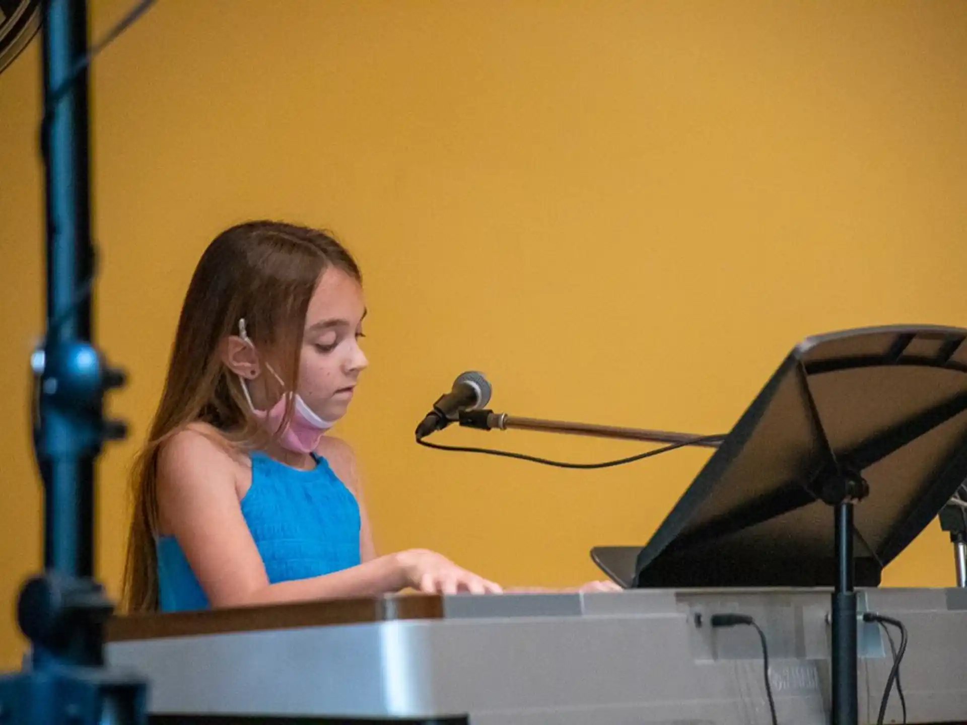 a woman playing the piano